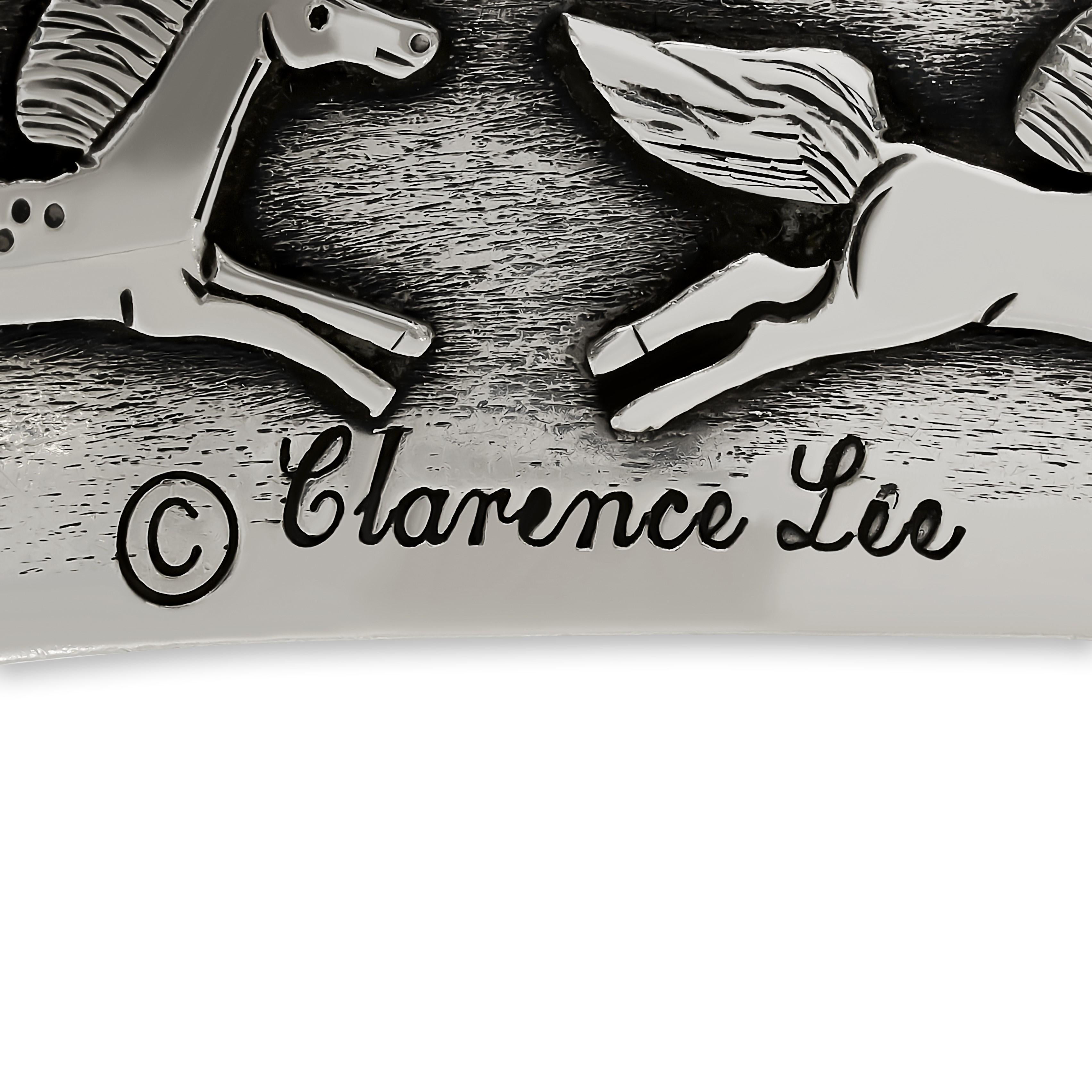 This Clarence Lee cuff bracelet features a dynamic design of multiple horses rendered in sterling silver, showcasing a vibrant array of colorful enamel accents.

Signed 