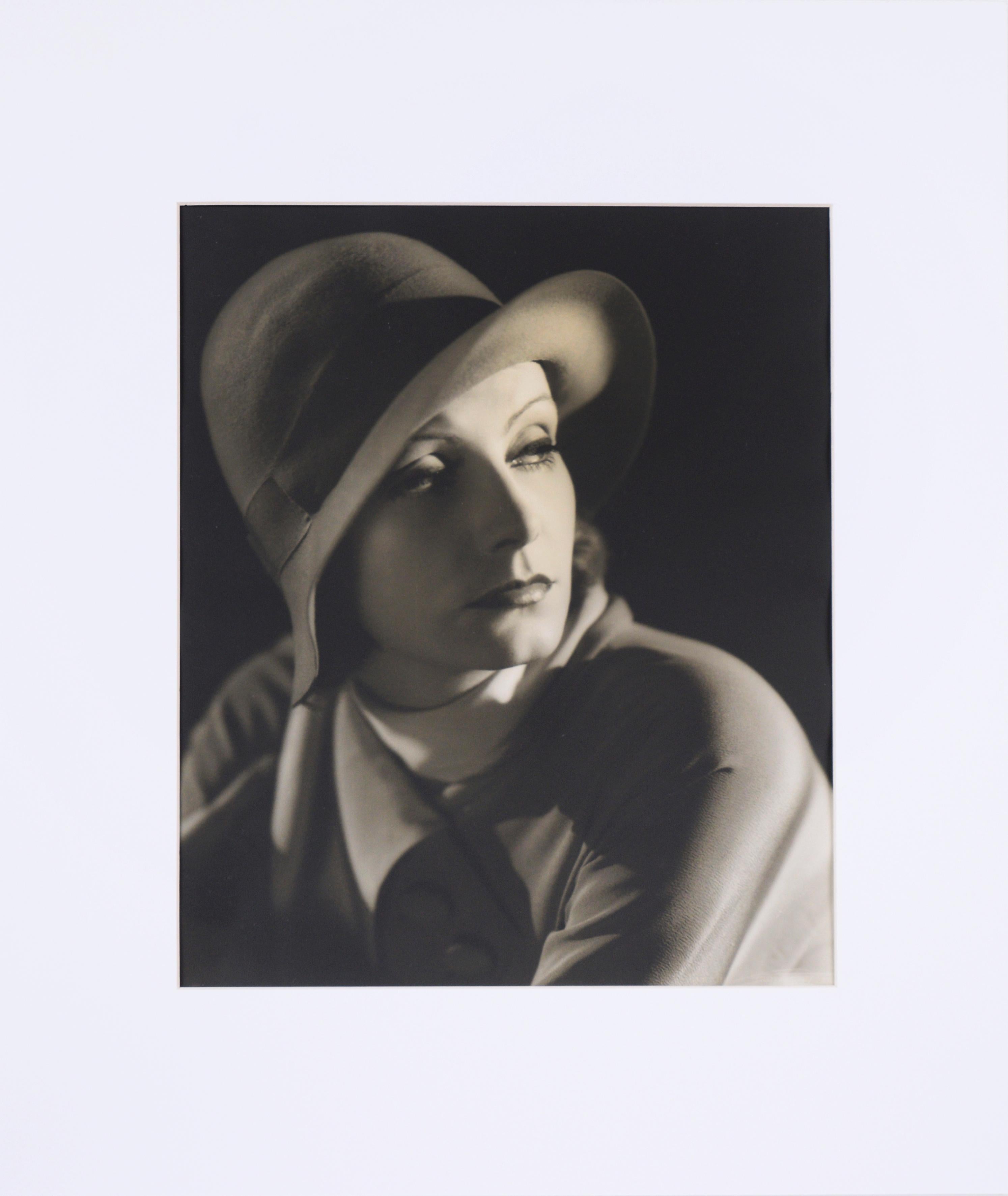 Greta Garbo - Black and White Photograph by Clarence Sinclair Bull, 1930

1930 Black and white portrait photograph of Swedish/American actress Greta Garbo (Swedish, 1905-1990) by Clarence Sinclair Bull (American, 1896-1979). Greta Garbo poses in a