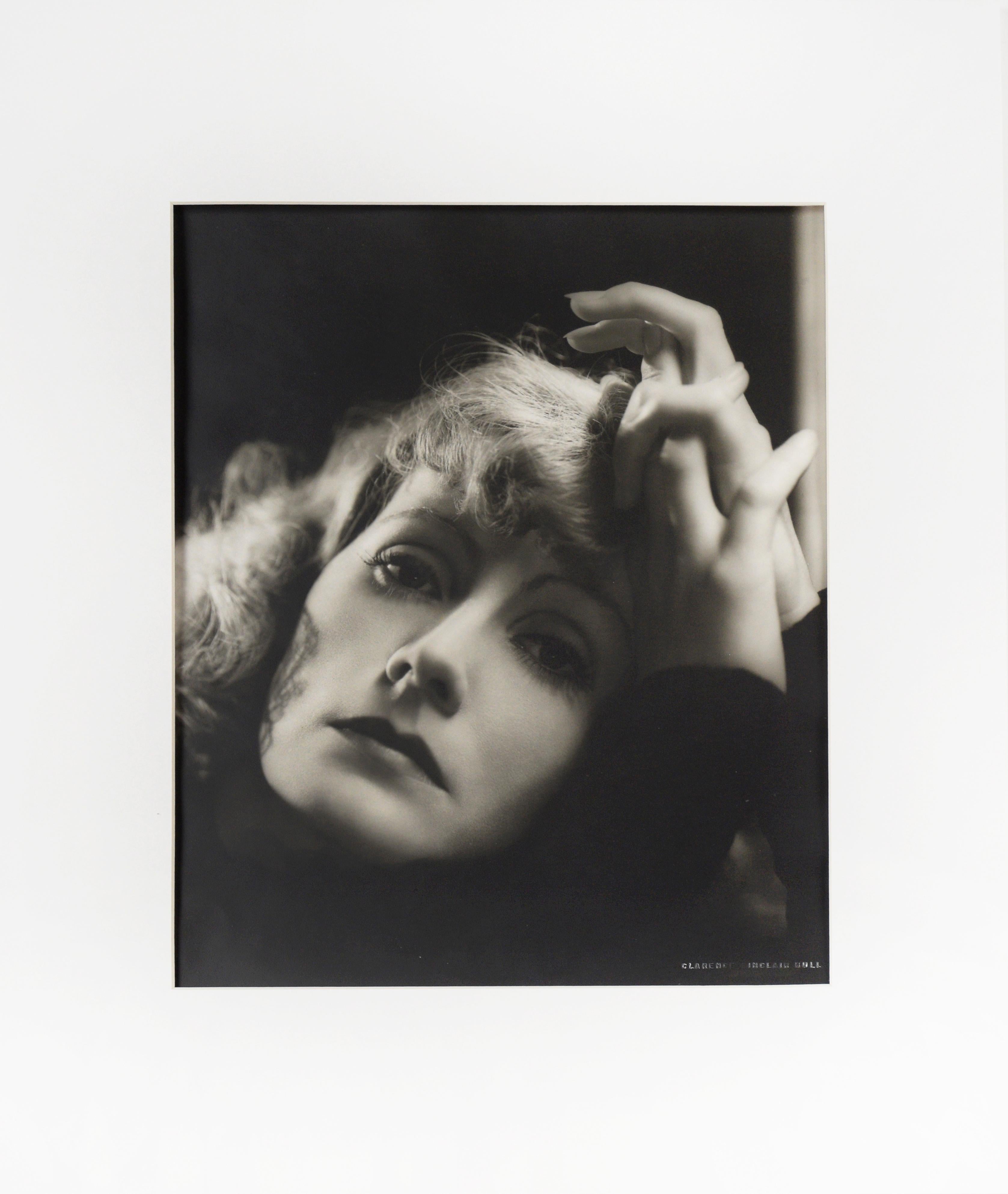 Greta Garbo "Her Rise And Fall #2" - 1931 Photograph by Clarence Sinclair Bull

 A black and white photograph by Clarence Sinclair Bull (American, 1896-1979), matte finish, double-weight paper, depicting a 1931 shot of Swedish/American actress Greta