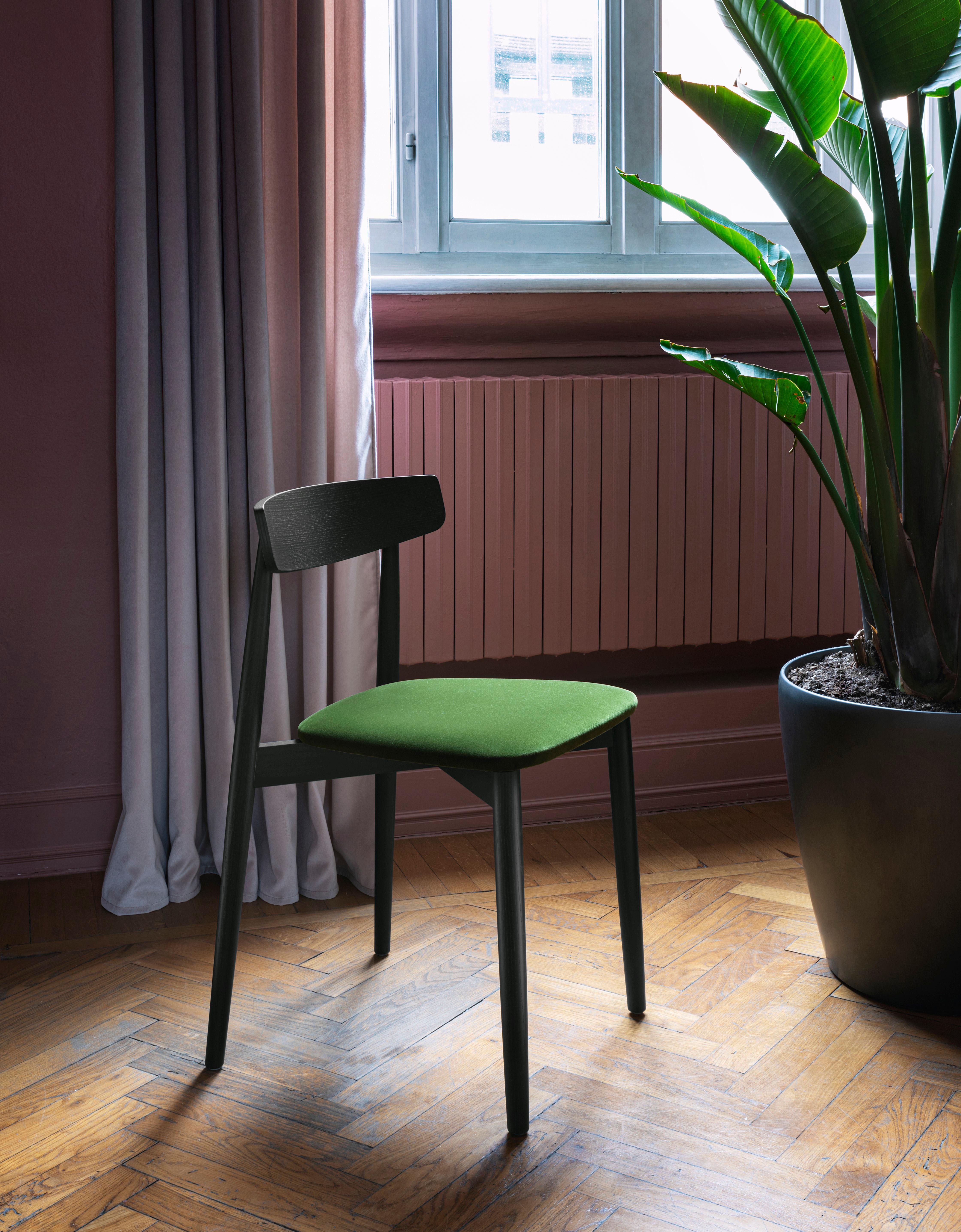 Parisian in character and drawing its inspiration from the traditional bistro chair, Claretta appears as a slender, impeccably groomed seat. The design is simple yet sports essential details, such as the assertive way in which the turned legs join