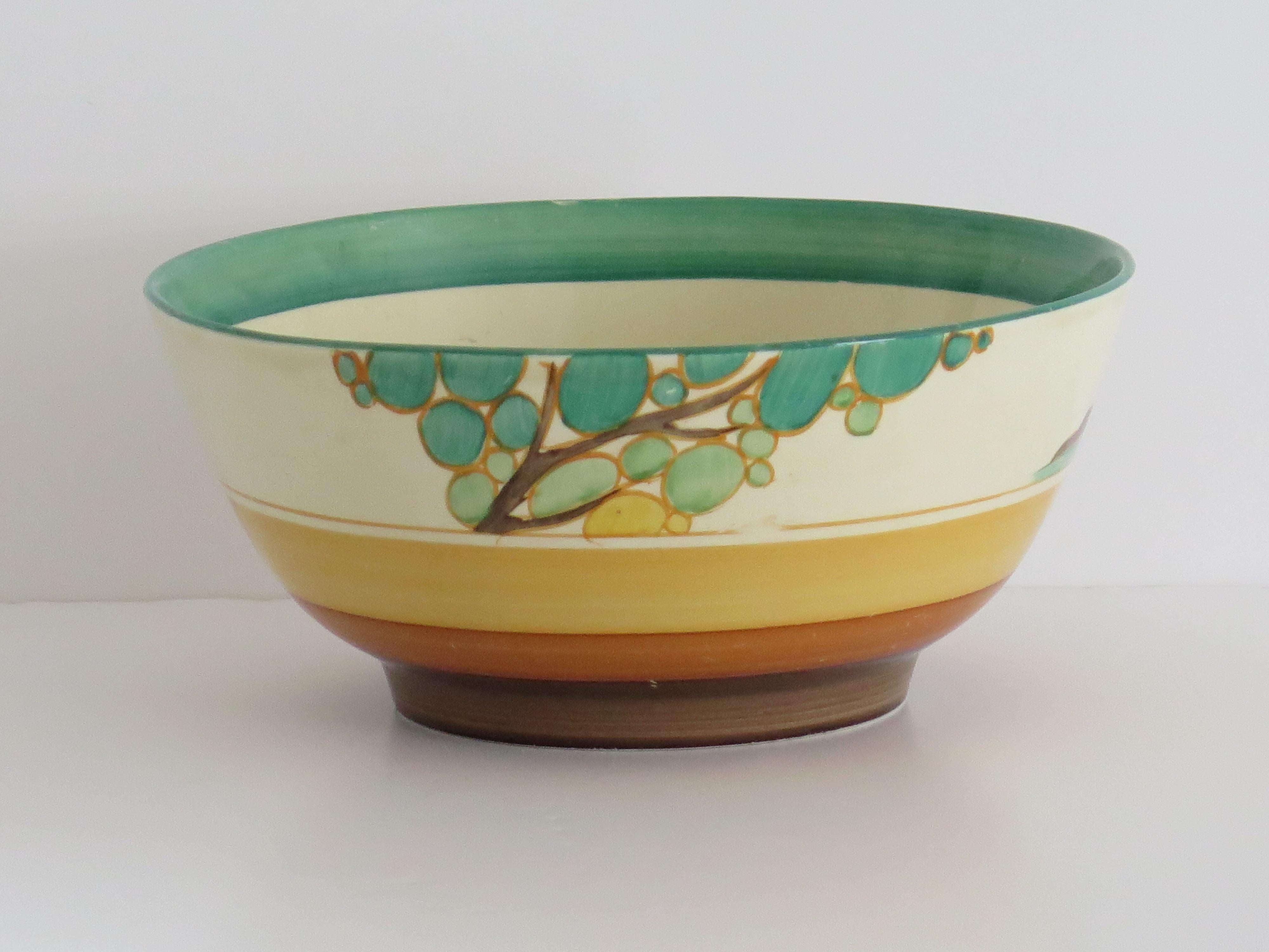 This is a good hand-painted Clarice Cliff Bowl of 8 inches diameter, in the classic landscape Bizarre Fantasque pattern called Secrets.

The bowl is well potted on a low foot with all hand painted decoration.

The decoration has a river estuary next