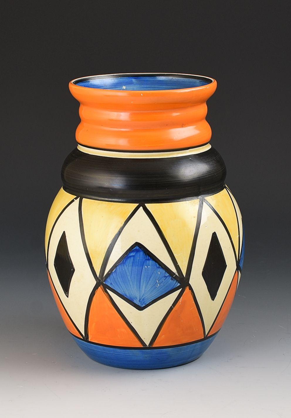 A fabulous rare abstract design that is boldly shown on this really popular shape. This variant/colourway of Double Diamonds i have not seen before and works perfectly on the vase. There is a tiny bit of wear to the blue on one panel otherwise i can