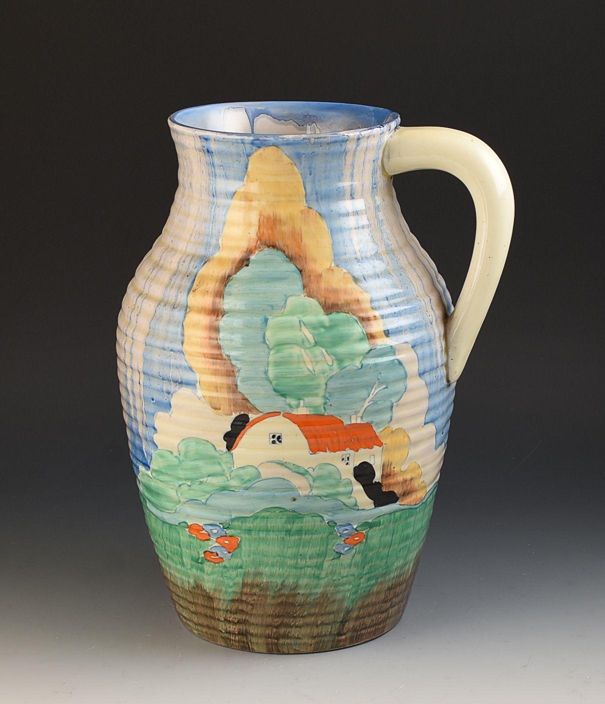 A beautiful and rare Lotus jug in the Newlyn design. This will date to 1934 and is only the second one i've seen of these in 34 years of dealing in Clarice cliff pottery. Really nicely decorated showing a full version of the pattern. GUARANTEED to