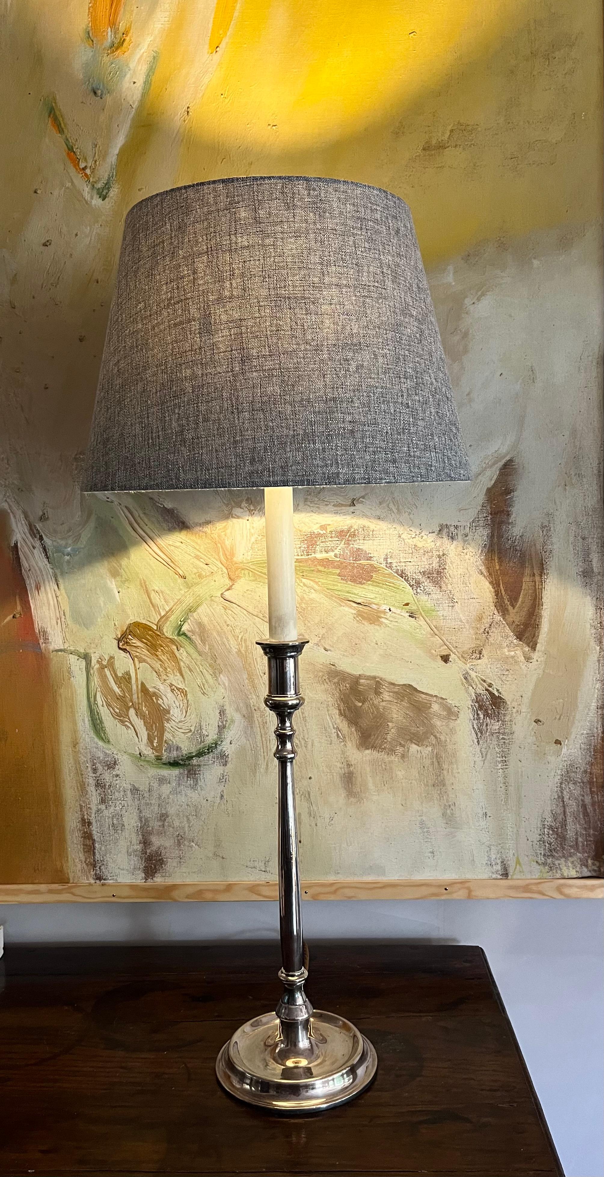 An elegant tall silverplate lamp. Provenance Claridges Hotel London. Rewired. Shade not included.