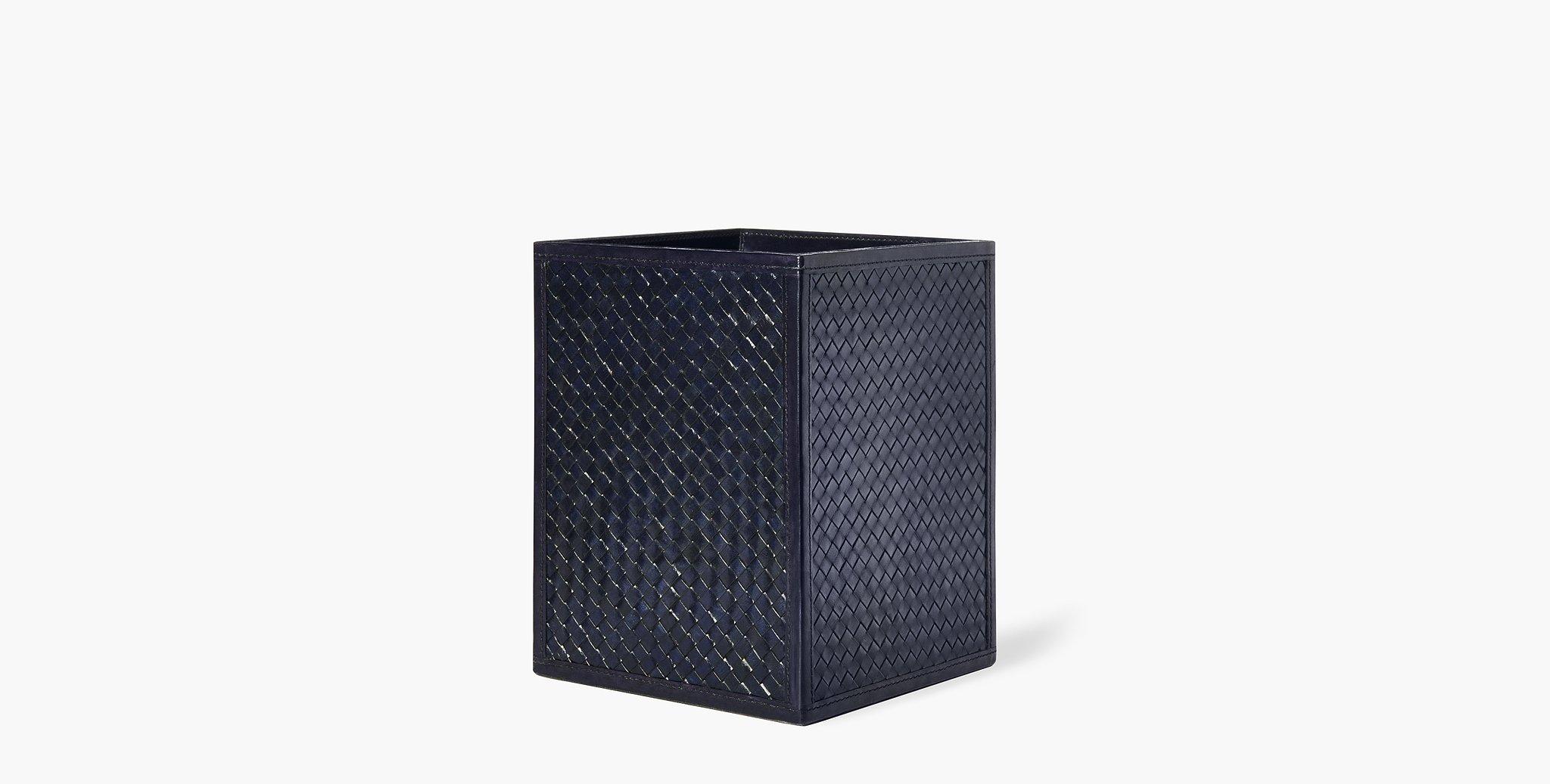 The Clarion wastebasket features a sleek profile and textured leather exterior that will hold up to regular day-to-day use.

Basketweave leather design
Imported