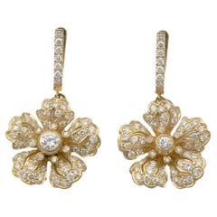 Claris.A Boucles d'oreilles fleurs en or jaune 18 carats et diamants
