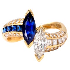 Claris-A Twist Marquise Diamond and Sapphire 18Kt Gold Toi et Moi Ring