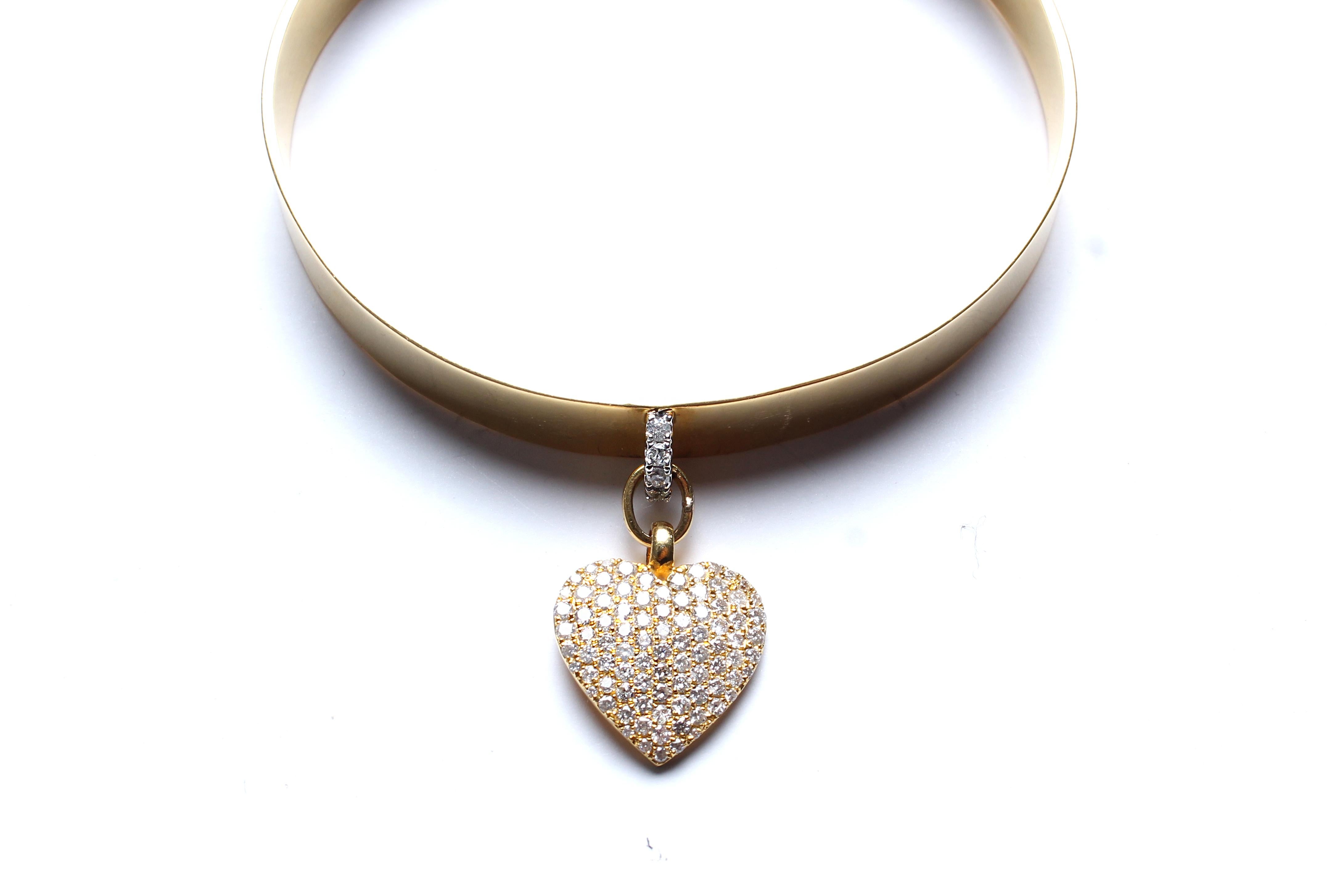 14K Gold bangle, Diamond heart charm. 
2 2/4