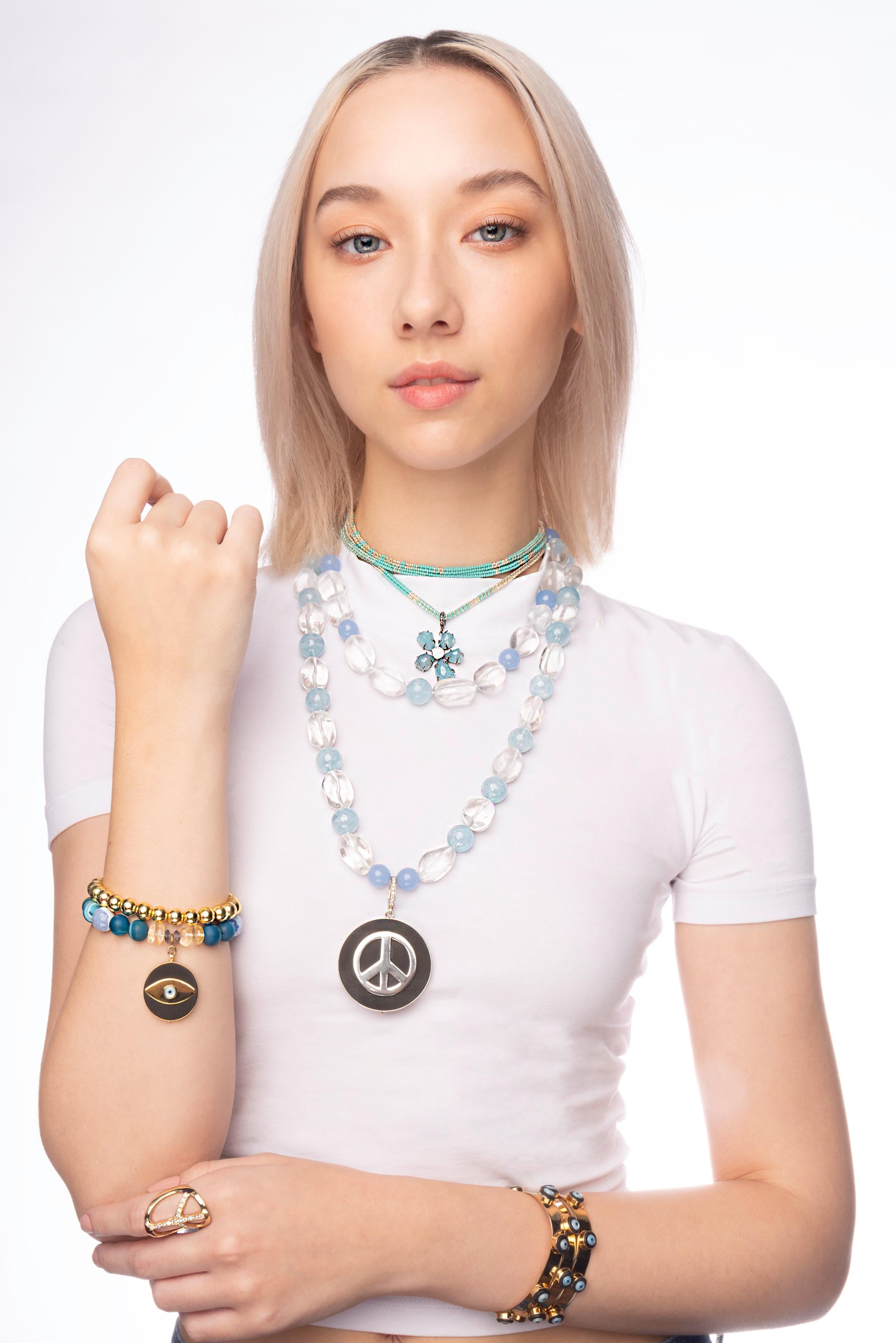 Double Strand Beaded Necklace consists of:
- 20 mm clear quartz beads
- white thread
- 14 mm aquamarine grade AAA+ beads
- 12-14 mm chalcedony grade AAA+ beads
- silver clipping at back that connects the two strands
- approximately 18