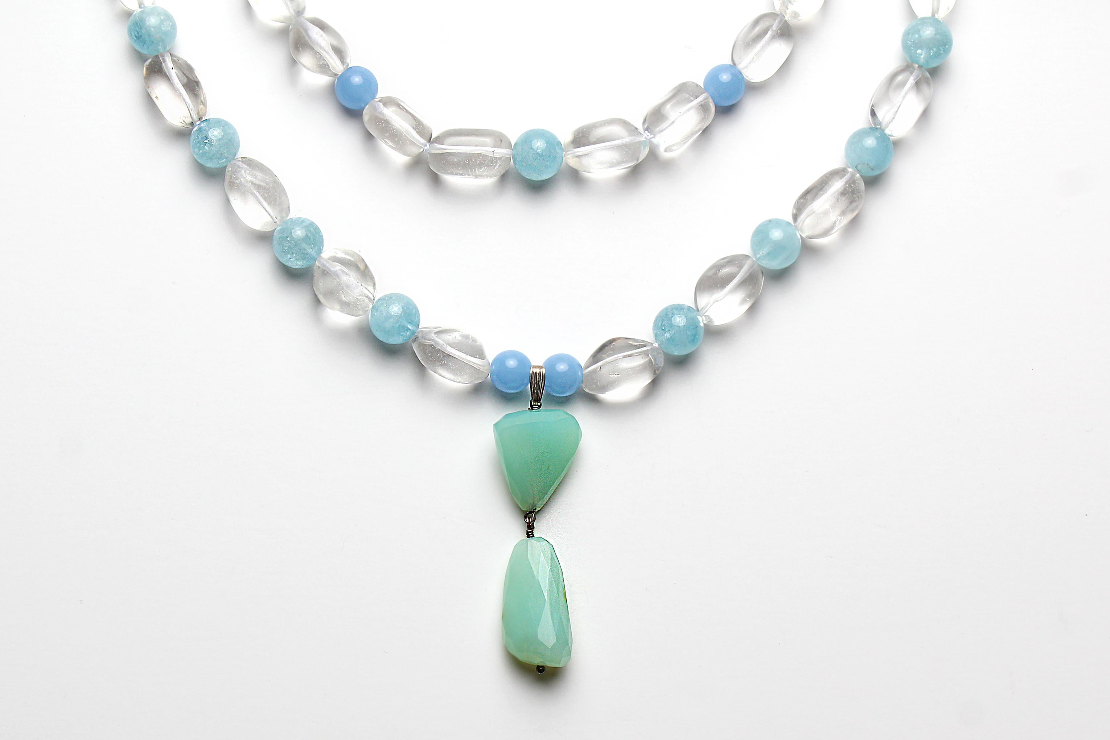 Double Strand Beaded Necklace consists of:
- 20 mm clear quartz beads
- white thread 
- 14 mm aquamarine grade AAA+ beads 
- 12-14 mm chalcedony grade AAA+ beads 
- silver clipping at back that connects the two strands
- approximately 18