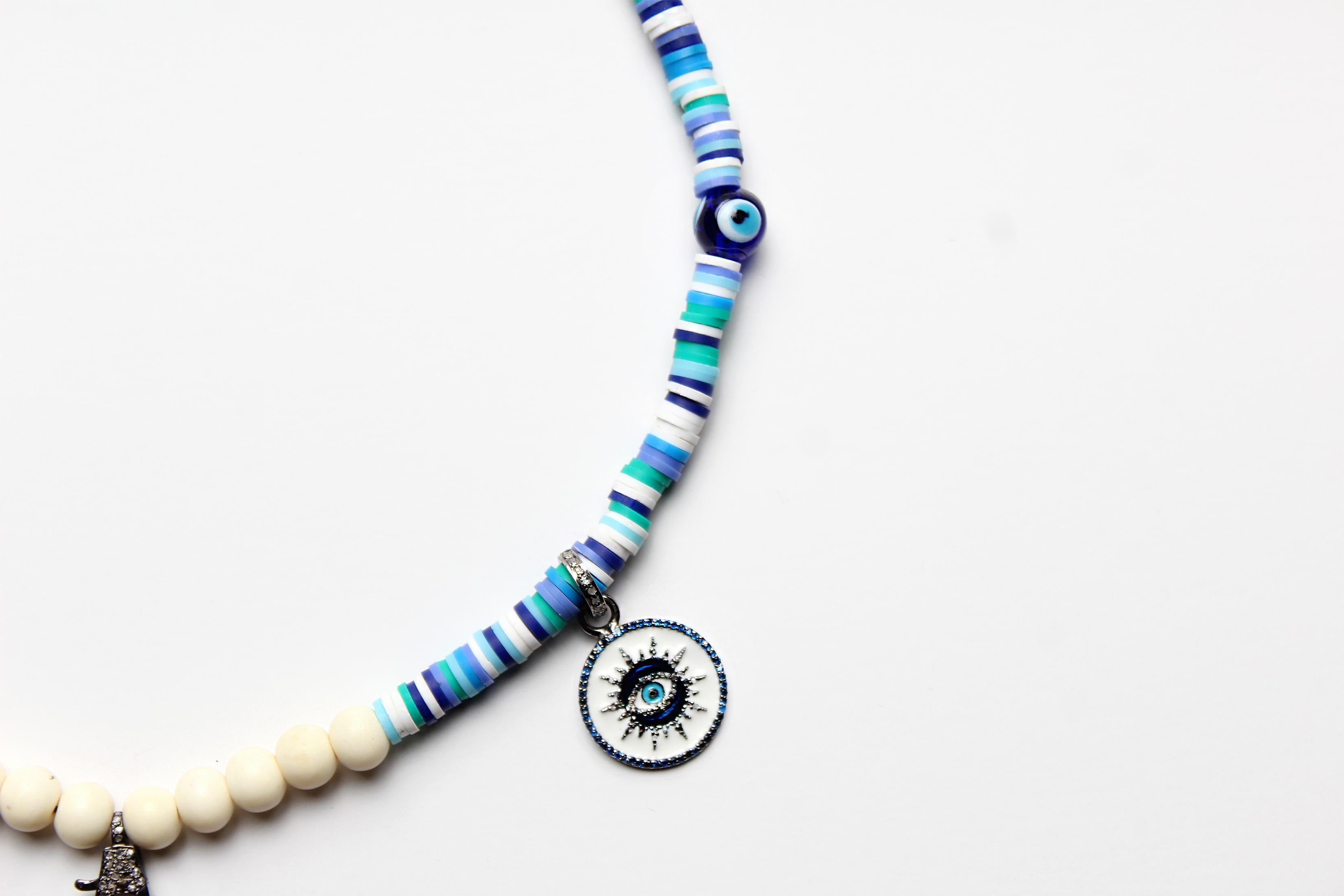 CLARISSA BRONFMAN Collar asimétrico azul y colgante estrella solar bicolor de ébano Contemporáneo en venta