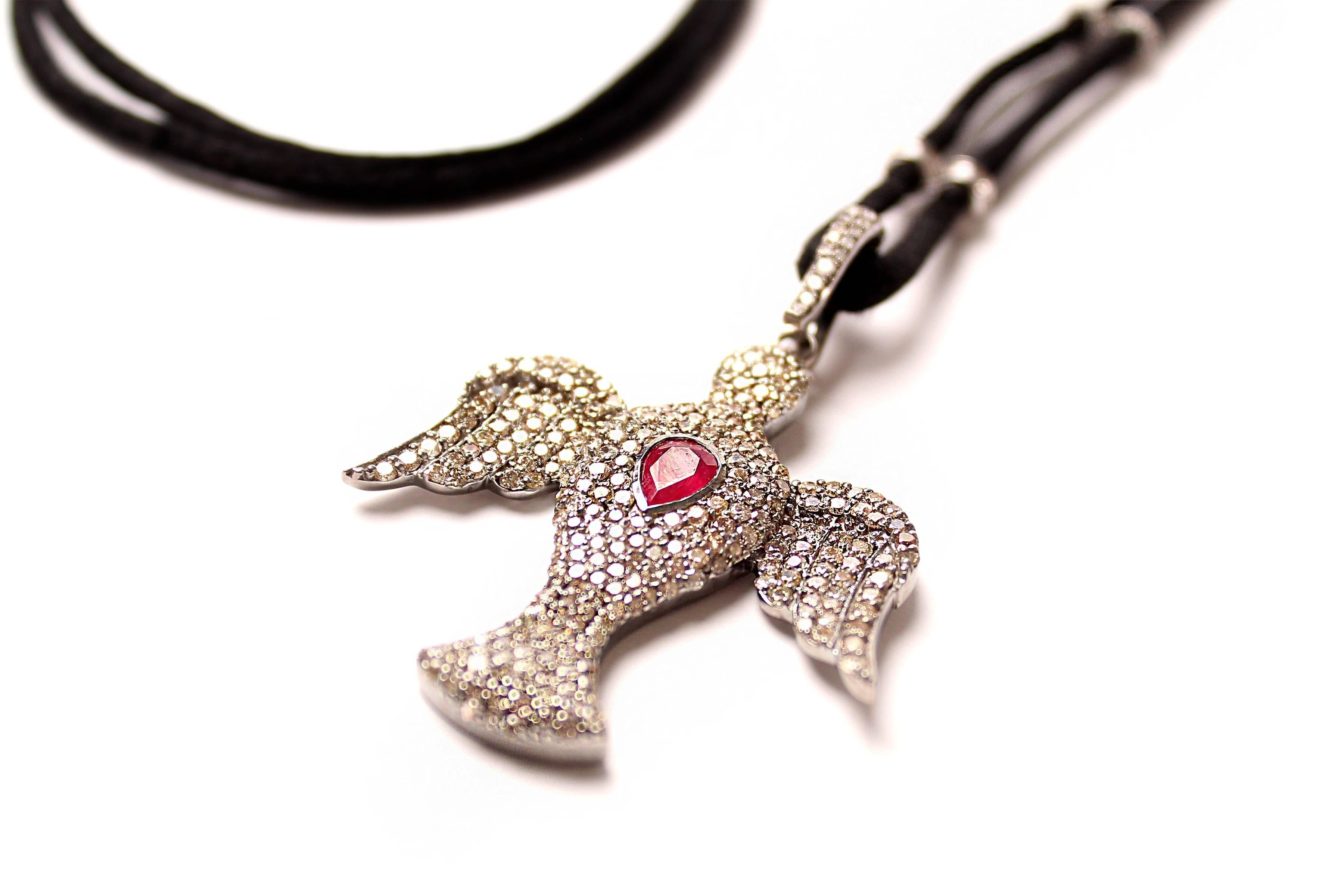 Diamond and ruby pendant with removable diamond and silver clasp. Adjustable suede cord with diamonds on silver rings.