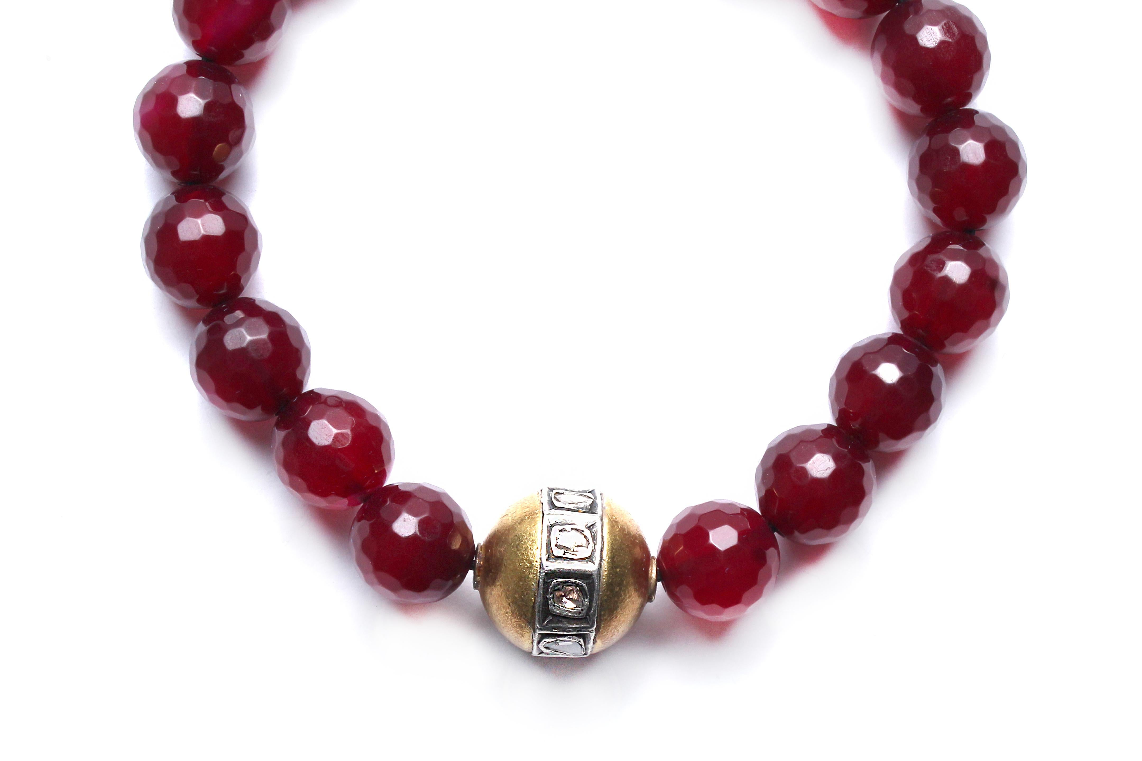 Garnet beads, gold plated tumbler bead with silver and rose cut diamond. 
Elastic fit. 