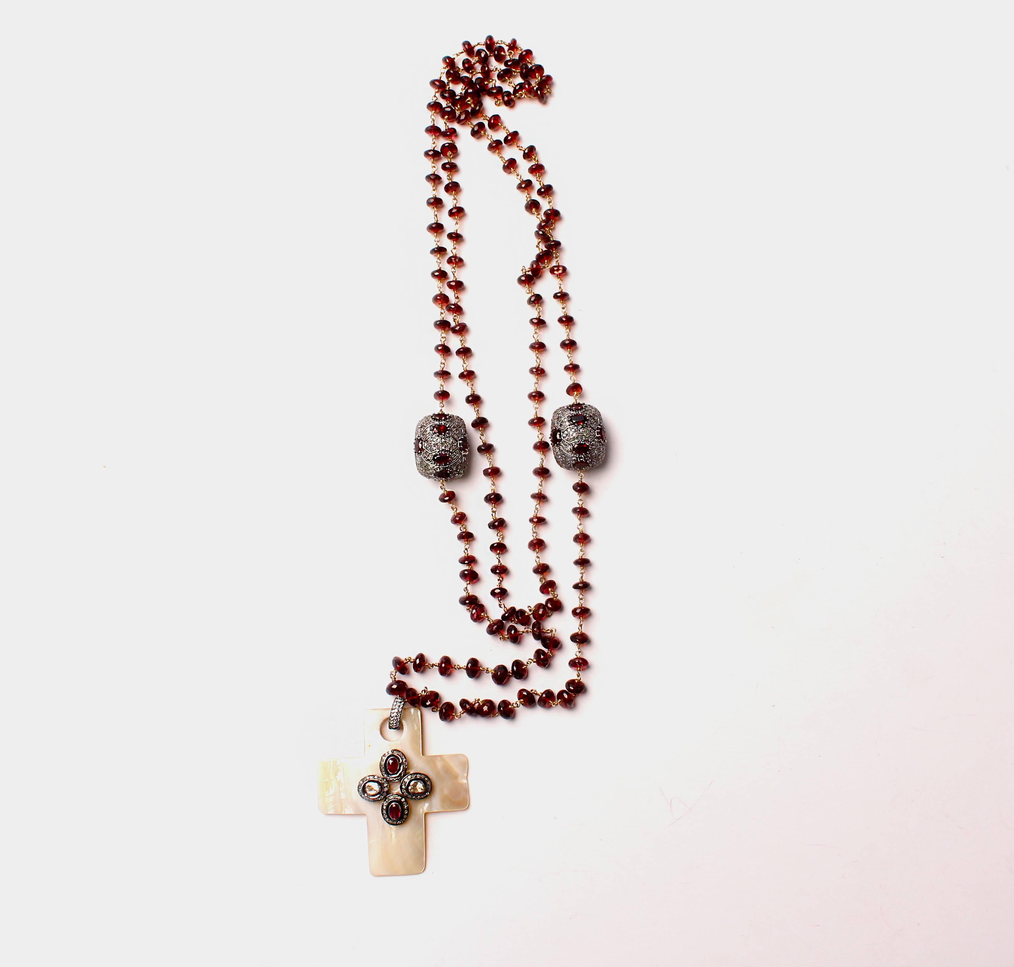 Garnet beads, mother of pearl cross with diamonds and rubies pendant.



*****Please take note that all religious symbolism can be replaced with an alternate item matching to price, or for higher charge depending on value.