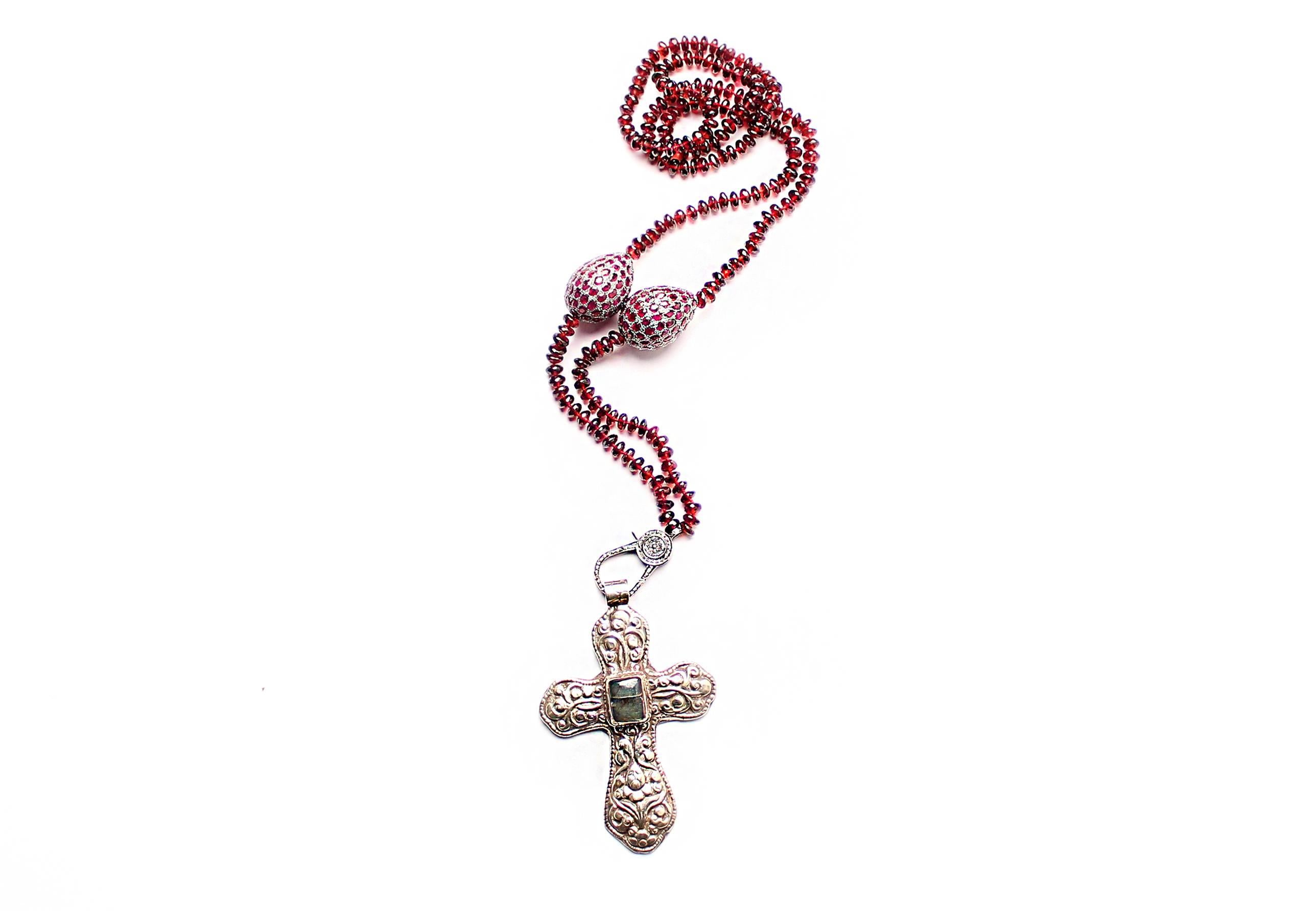 Silver and green onyx cross pendant with loop on top. Garnet beads with garnet stone and silver tumblers, and diamond/silver clasp.
