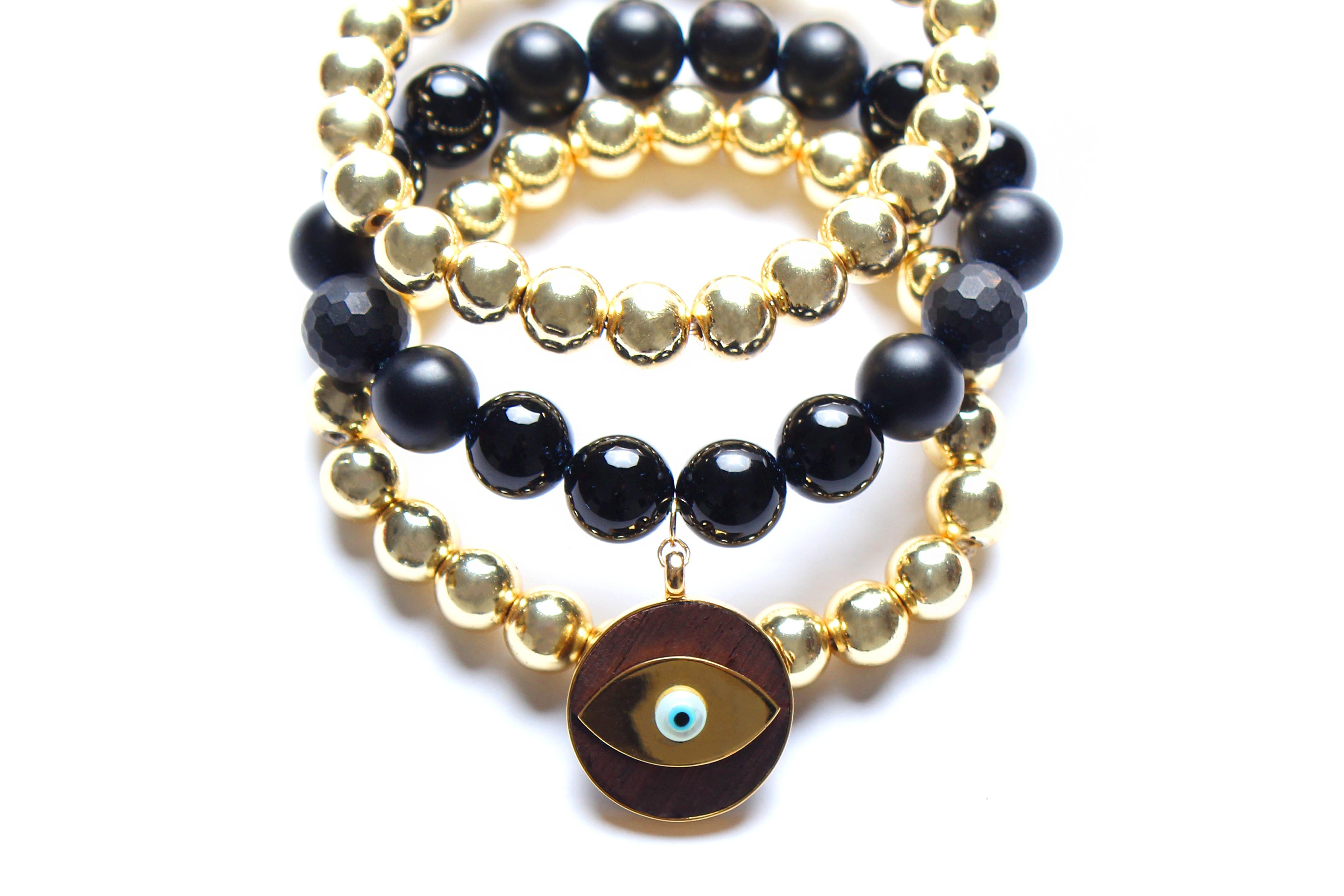 PRICE ADJUSTED TO ALTERATIONS LISTED BELOW:

NOW ONLY 4 BRACELETS AVAILABLE:

Bracelet 1 & 2: plain 8mm hematite 14k gold plated beaded bracelets
Bracelet 3 : 8mm hematite 14k gold plated beads, ebony, 14k gold, enamel evil eye charms
Bracelet 4: