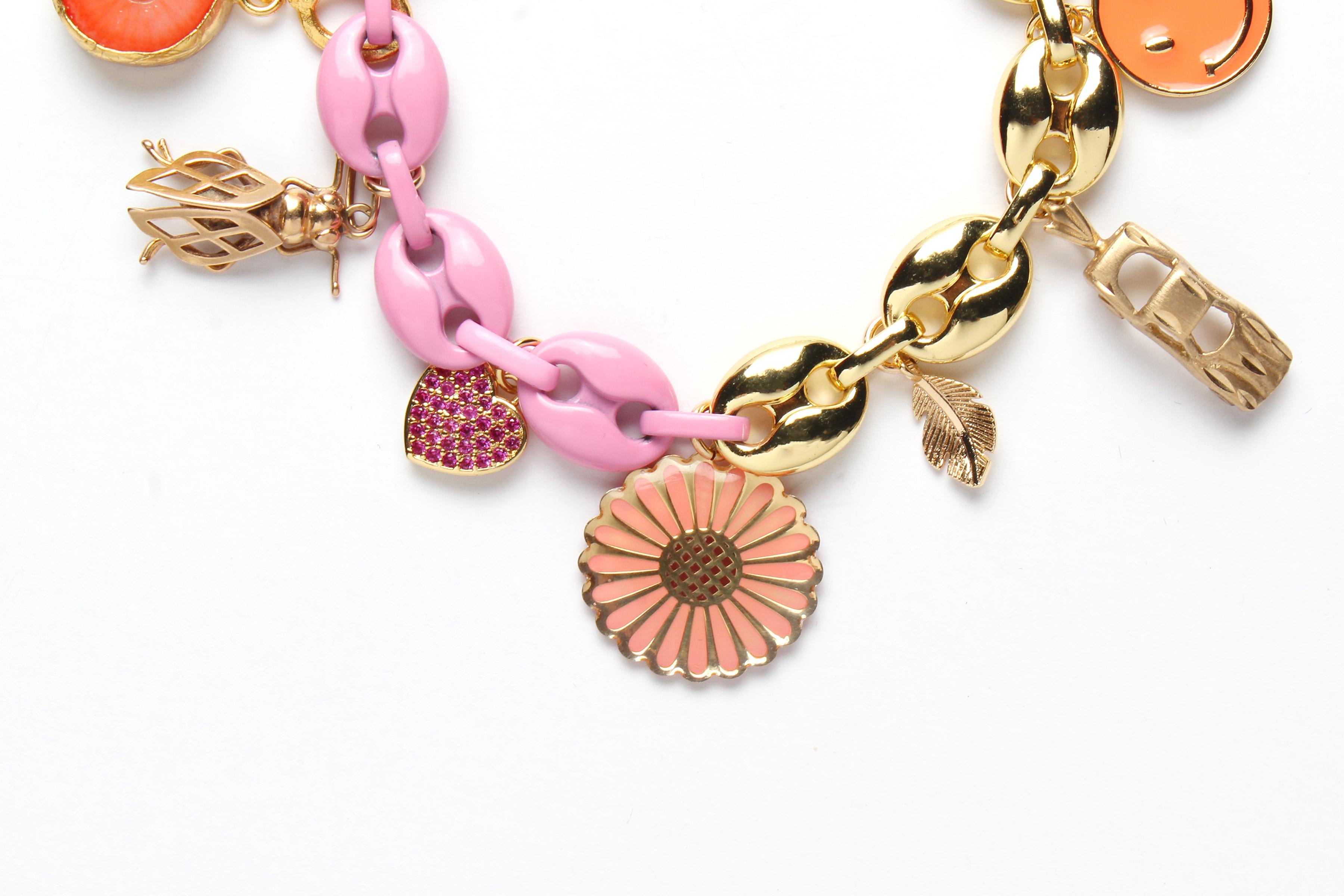 - 925 sterling silver bracelet 14k gold plated, 
- pink enamel,
- 14k solid gold clock,
- coral turquoise 14k gold evil eye,
- 14k solid gold cricket,
- 925 sterling silver 14k gold plate pink sapphire heart, - 14k gold enamel flower charm,
- 14k