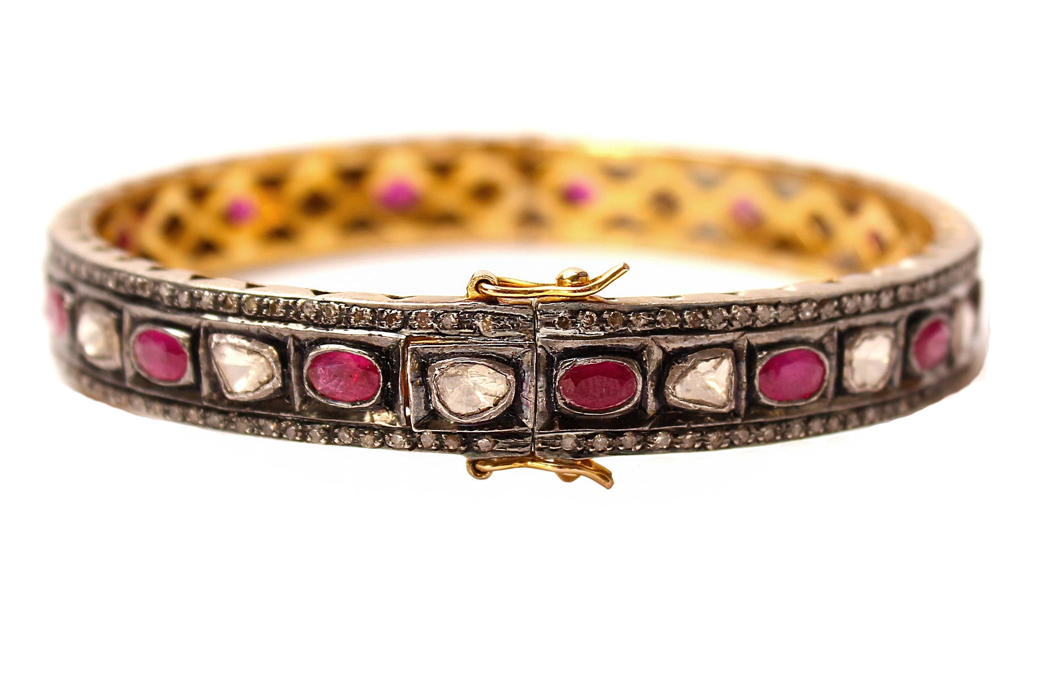 Rosecut diamonds and rubies. Silver. Gold plate. Clasp.