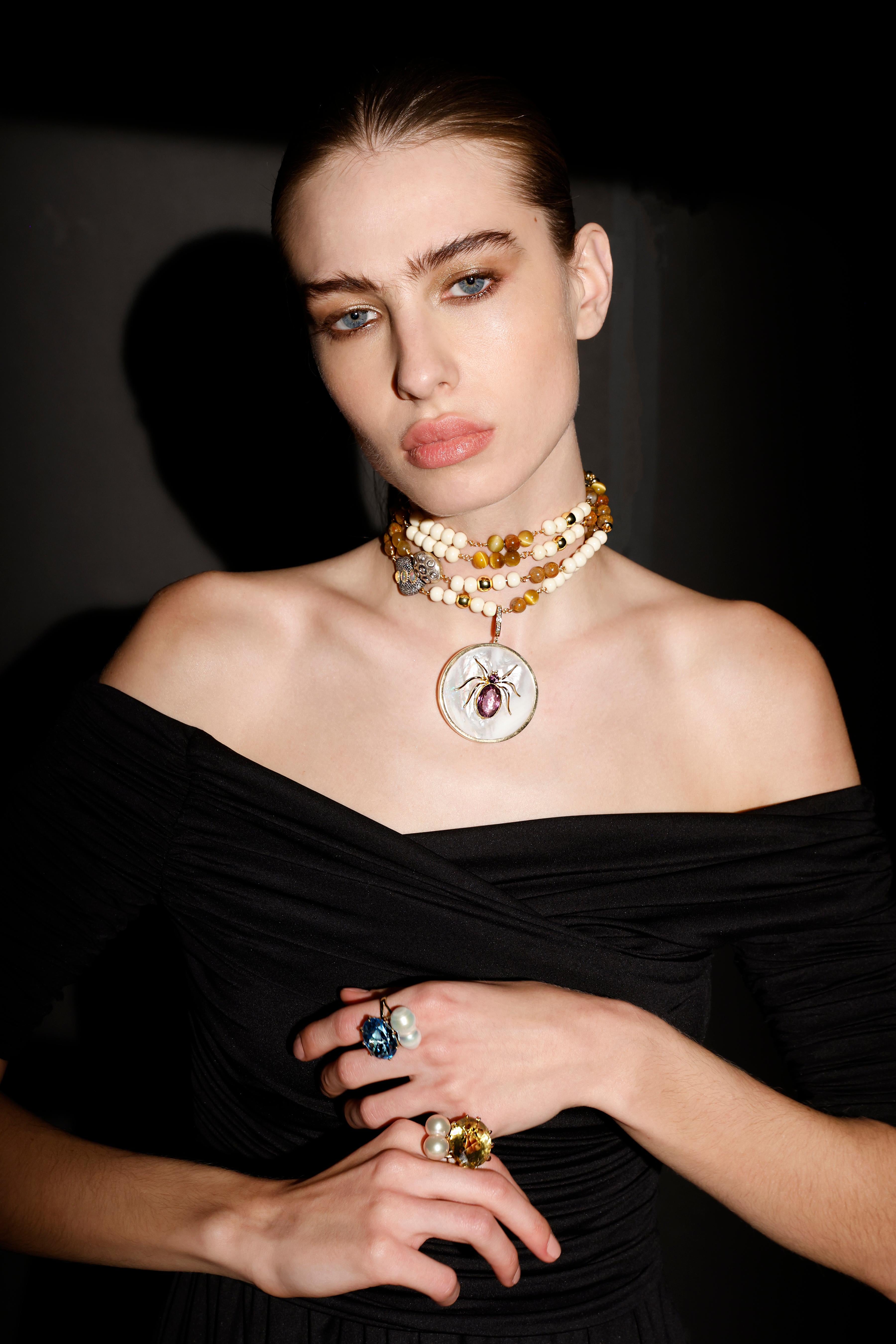 Signature Ebony Tree Of Life pendant consists of:
- Sterling silver
- 1.65