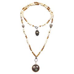 Clarissa Bronfman - Collier Carmen en os d
oeil de tigre et pendentifs en ébène avec arbre de vie