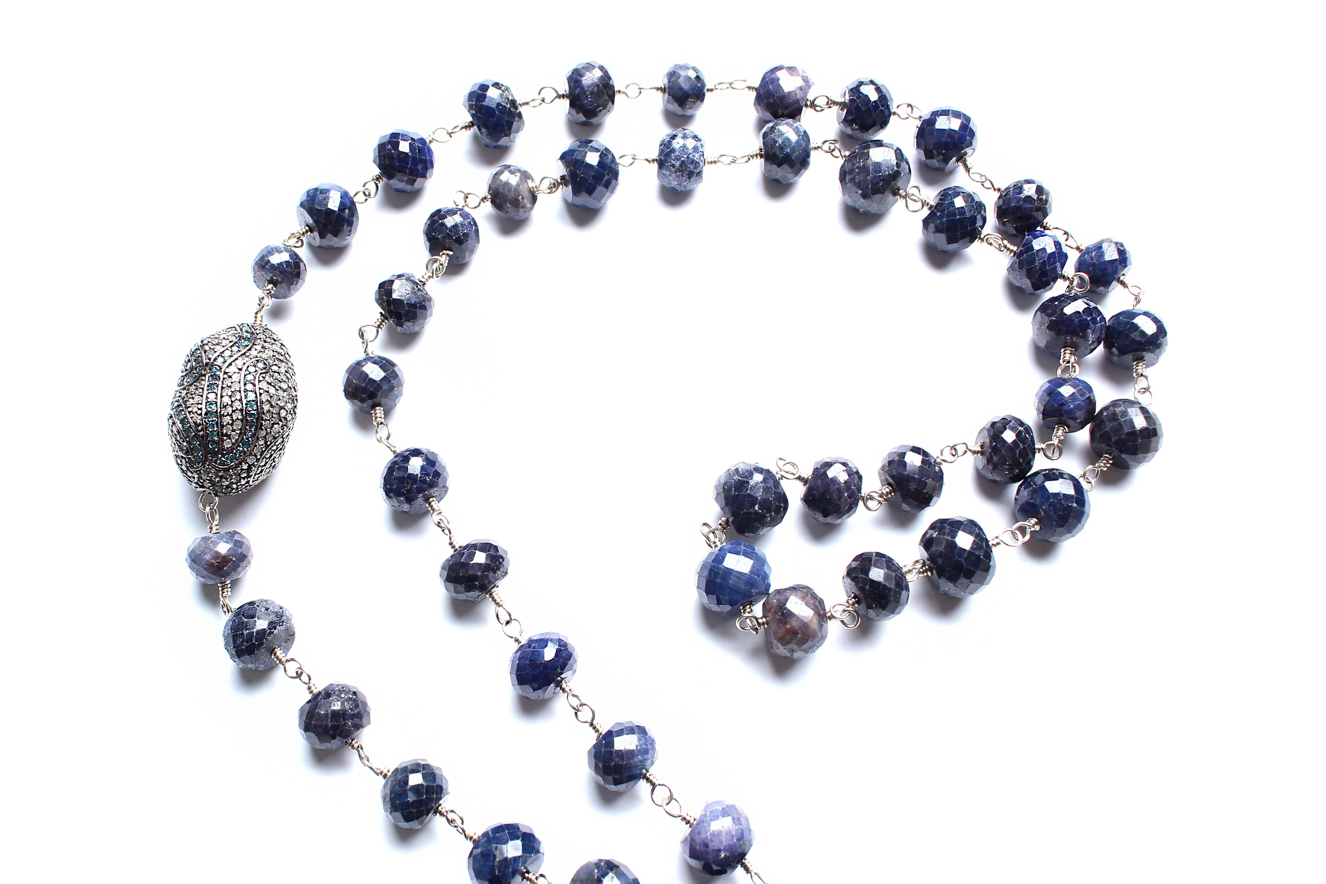 This beaded rosary consists of tourmaline faceted beads, sterling silver 925 wiring, double sided 925 sterling silver diamond clasp. Clasp opens and closes allowing to remove and change pendant. Sapphire, silver, and diamond tumbler bead. Full total