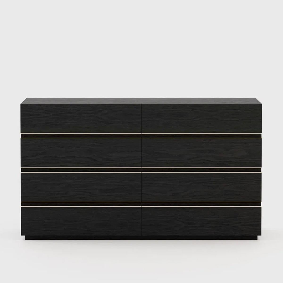 Chest of drawers Clark black ash with structure
in ash wood in blackened matte finish. With polished
stainless steel trims in gold finish. Including 8 drawers
with easy glide system.
Also available with other finishes on request.