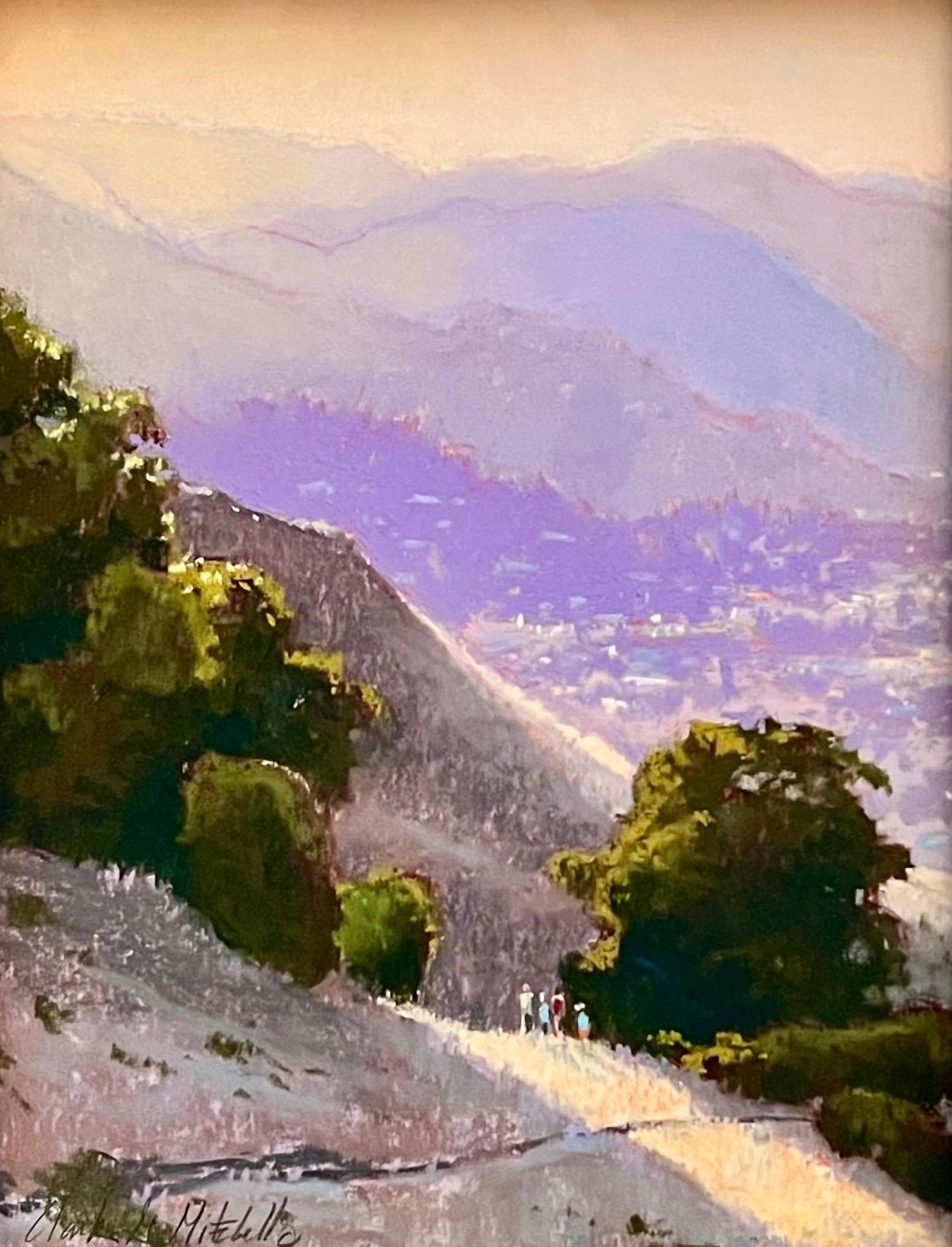 "Hazy Day Hikers"  is a plein air pastel painting by Cotati, CA based artist Clark Mitchell. This sublime piece depicts an aerial trail side view of a mountain side. Off in the distance, are hikers taking in the beautiful sunny day. Purple mountains