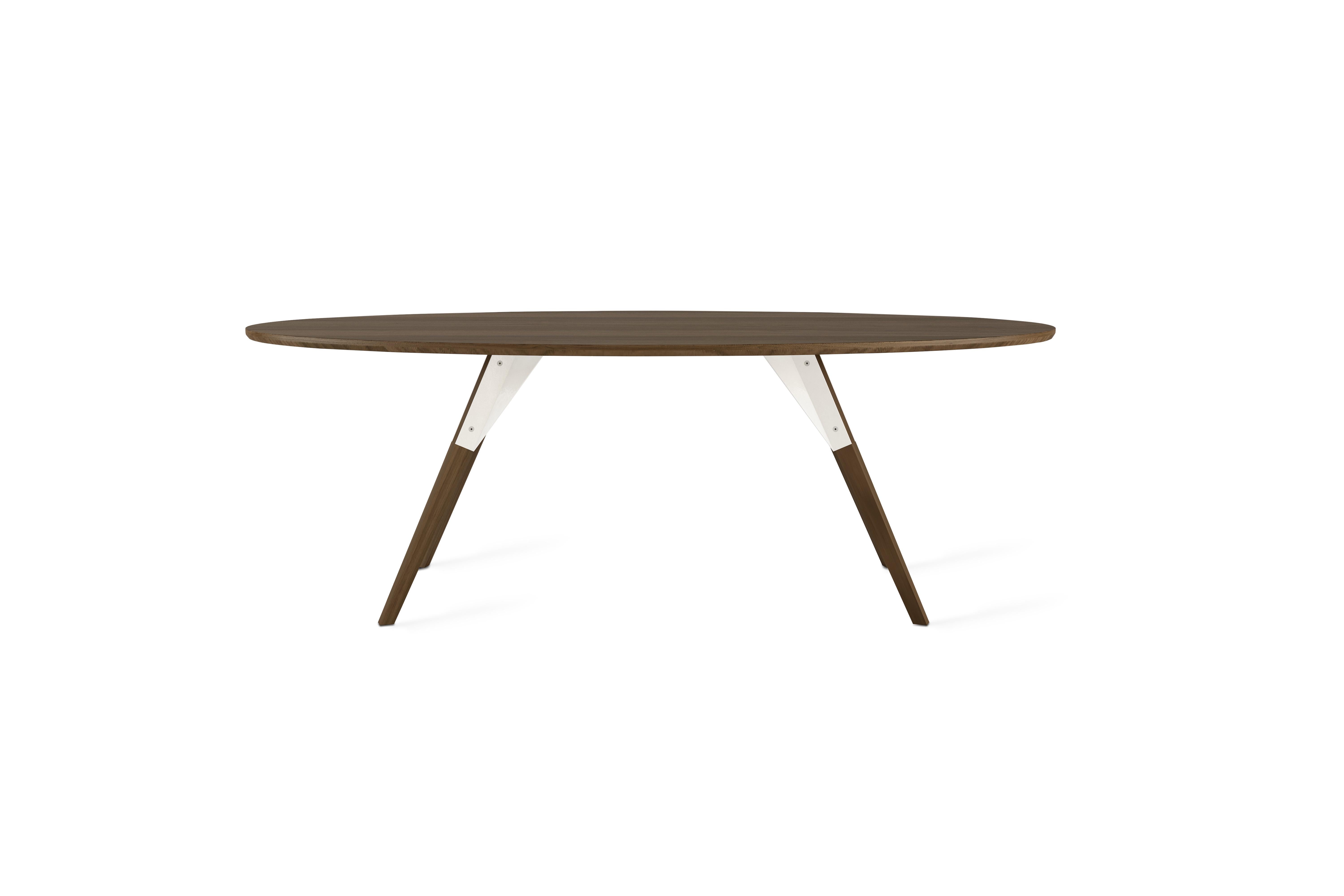 The Clarke Collection comes in ten different table top sizes, two wood species, and two metal finishes. The exposed stainless steel bolts blur the line between Scandinavian and Industrial styles.