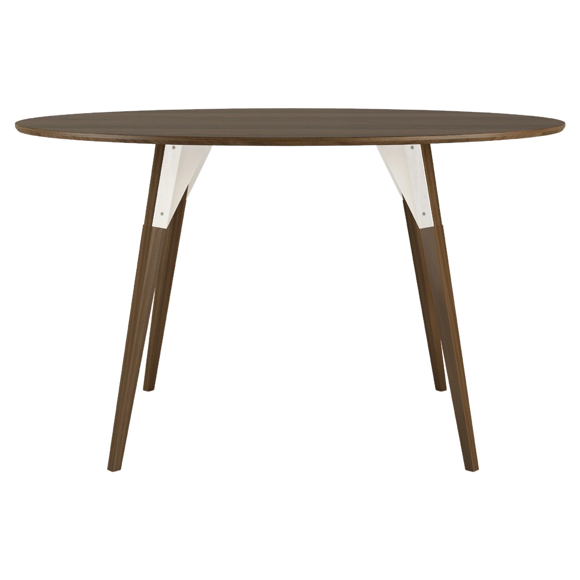The Clarke Collection comes in ten different table top sizes, two wood species, and two metal finishes. The exposed stainless steel bolts blur the line between Scandinavian and Industrial styles.
 