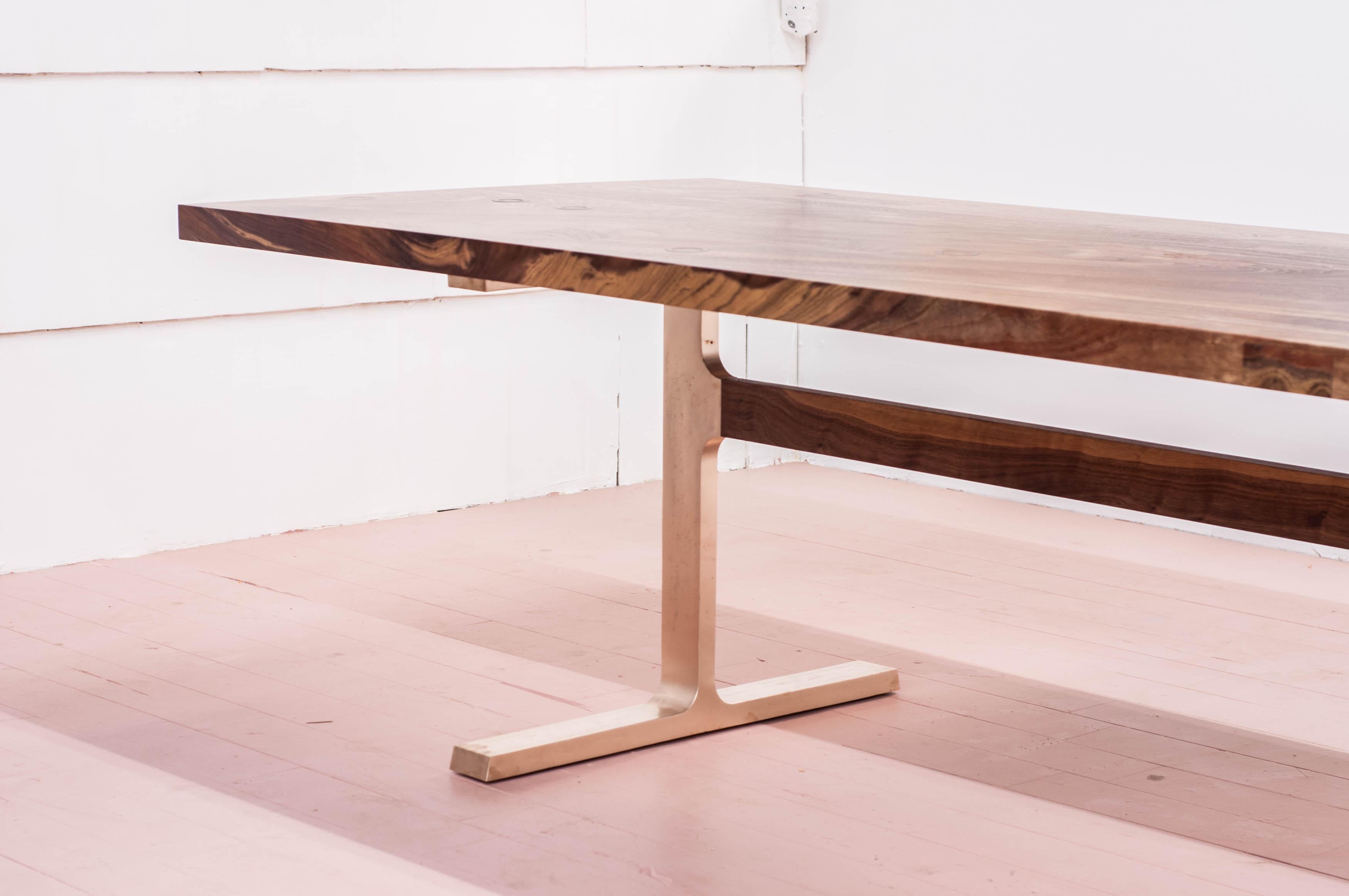 Distilled to its purest elements, the bronze Shaker table utilizes cast joinery components in the bronze legs and inlayed bronze rings in the wood top.

Available rectangular or as an oval. Custom sizing, configuration, and material choices