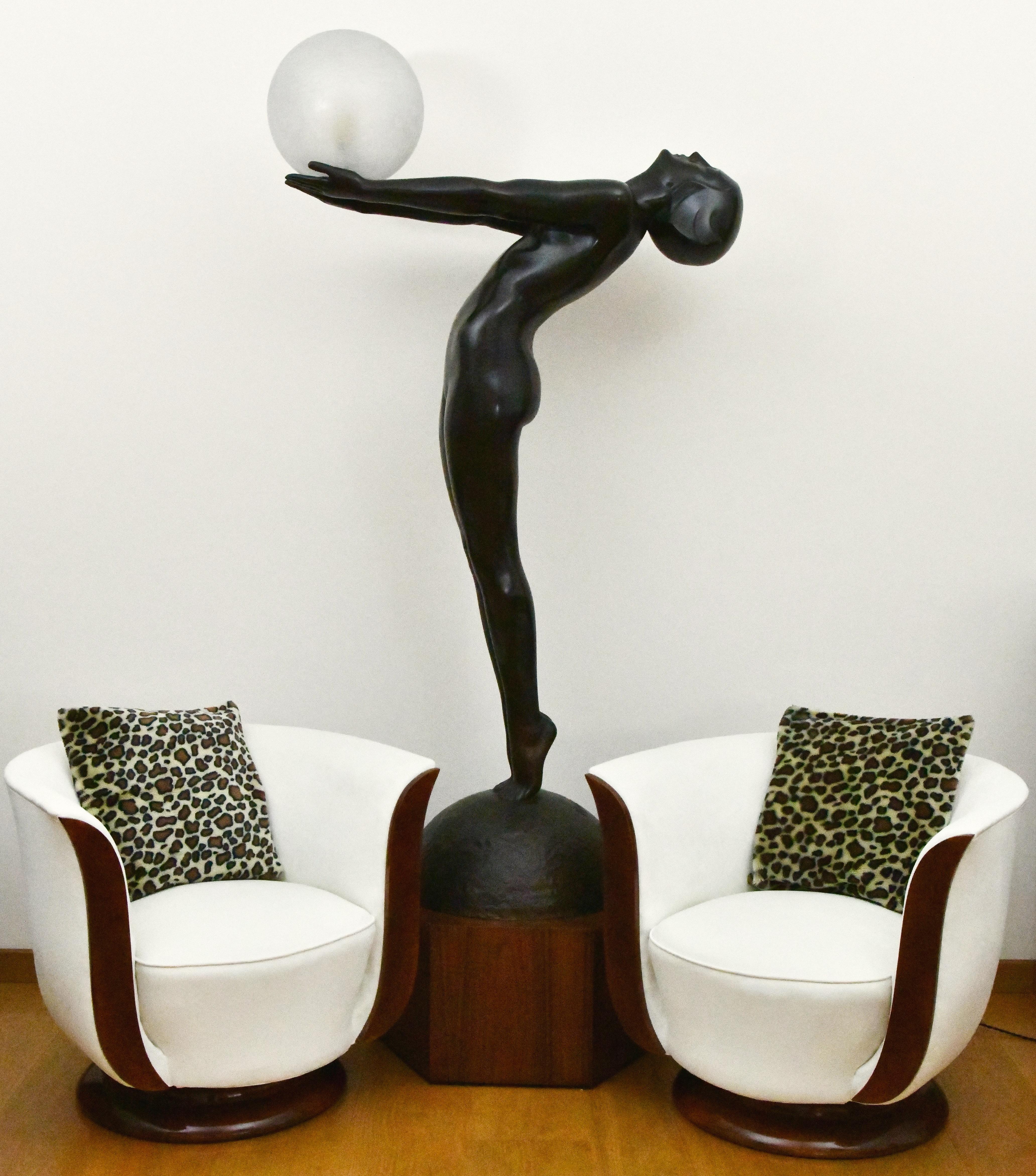 Clarté life size Art Deco bronze lamp standing nude with globe by Max Le Verrier. Patinated bronze on octagonal wooden base and with crackled glass globe. Design 1928. Posthumous cast at the Le Verrier foundry. 
Hand-crafted. 
With Certificate of