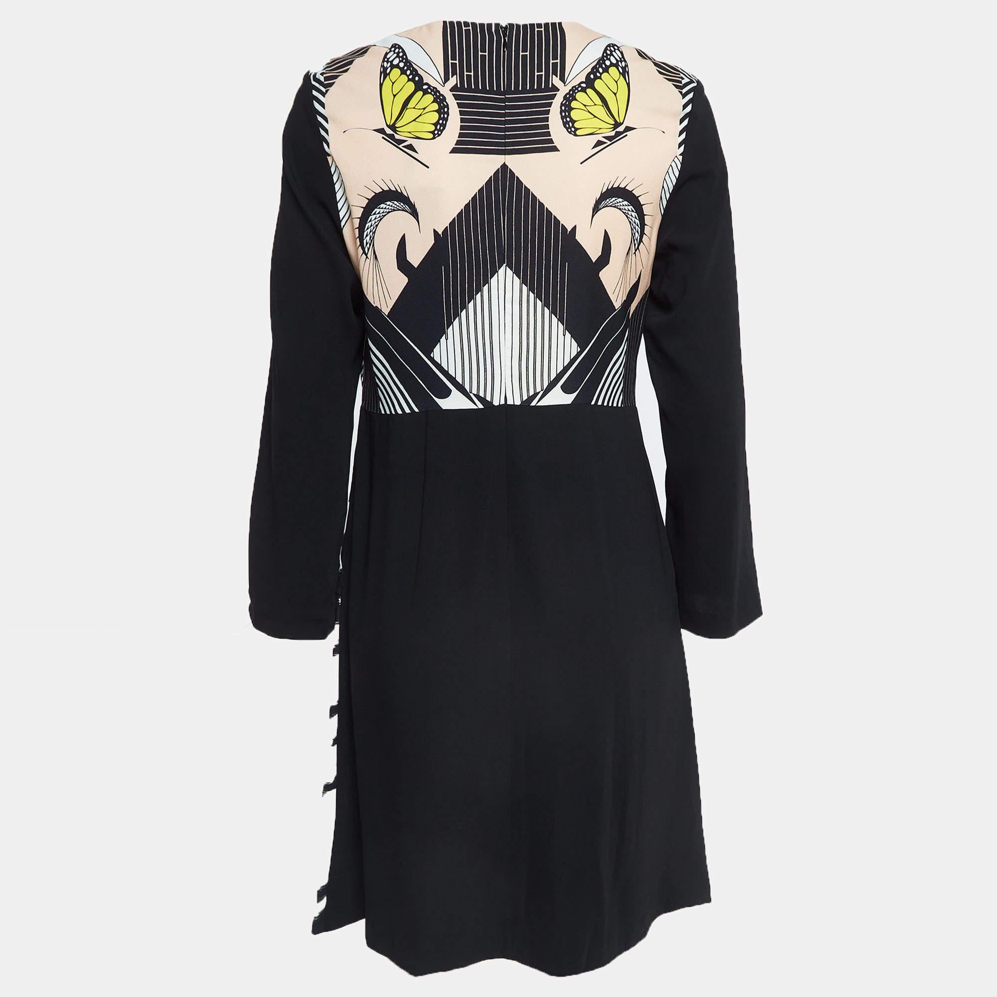 Exhibit a stylish look by wearing this beautiful designer dress. Tailored using fine fabric this dress has a chic silhouette for a framing fit. Style the creation with chic accessories and pumps.