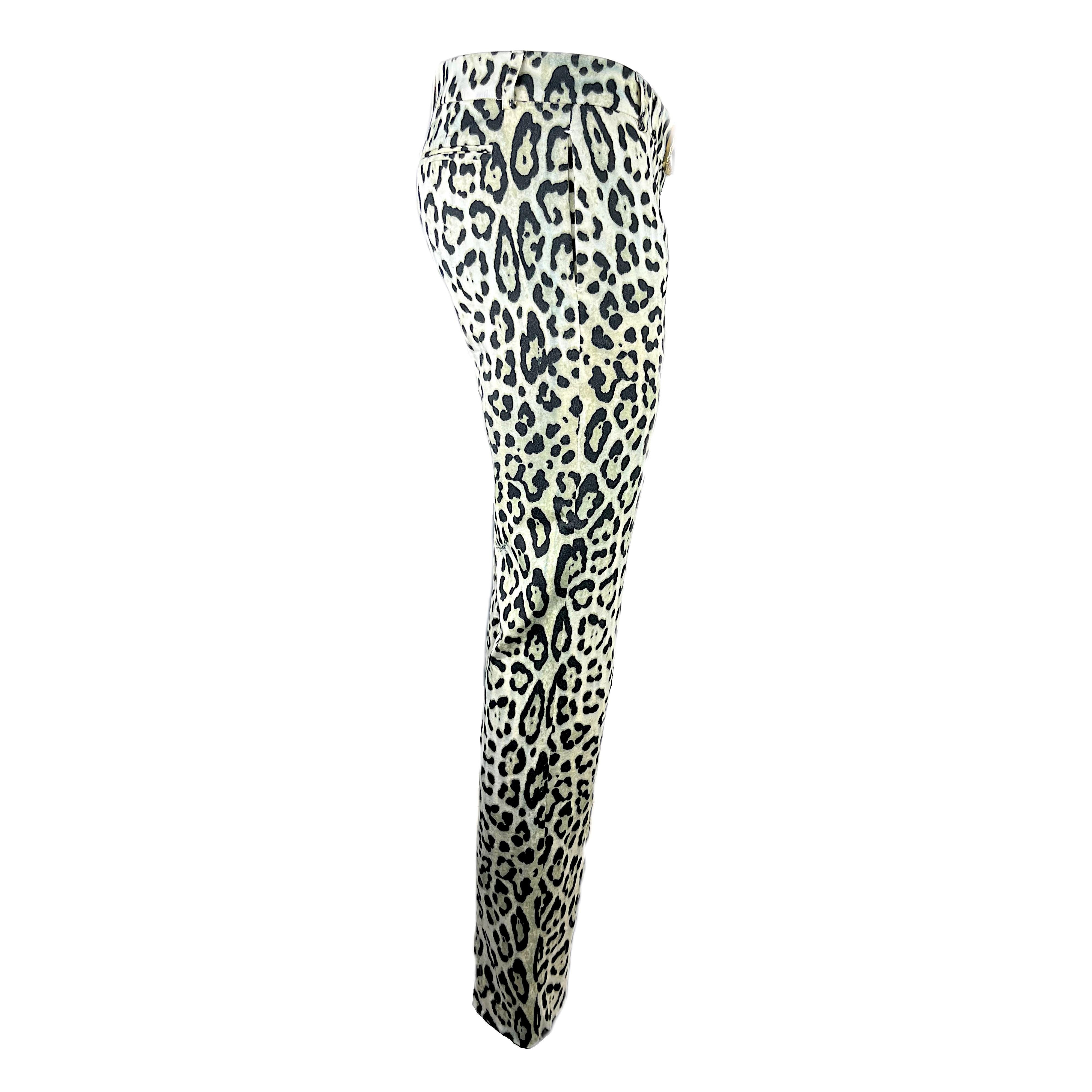 These pants are made of an iconic symbol of Roberto Cavalli's design: the white leopard print, which along with the zebra print represents one of his most popular signatures. 
The pants feature 2 front pockets and 2 rear pockets, a zip closure