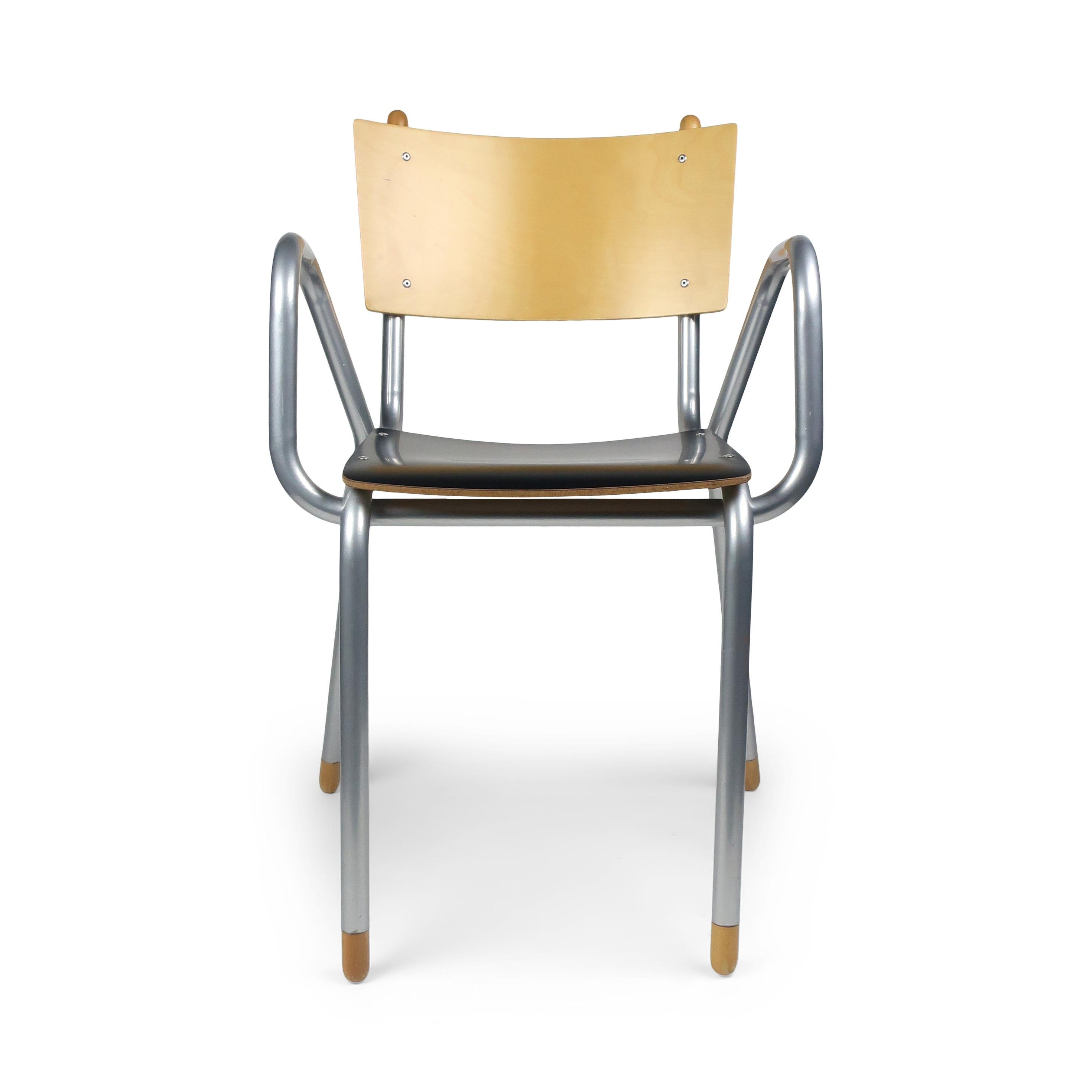 Designed by Maurizio Peregalli for ZEUS in 1996, the Classe Prima B armchairs have natural birch backs, black bilaminate seats, and silver epoxy painted metal frames. A whimsical silhouette with the attention to detail found in great Italian