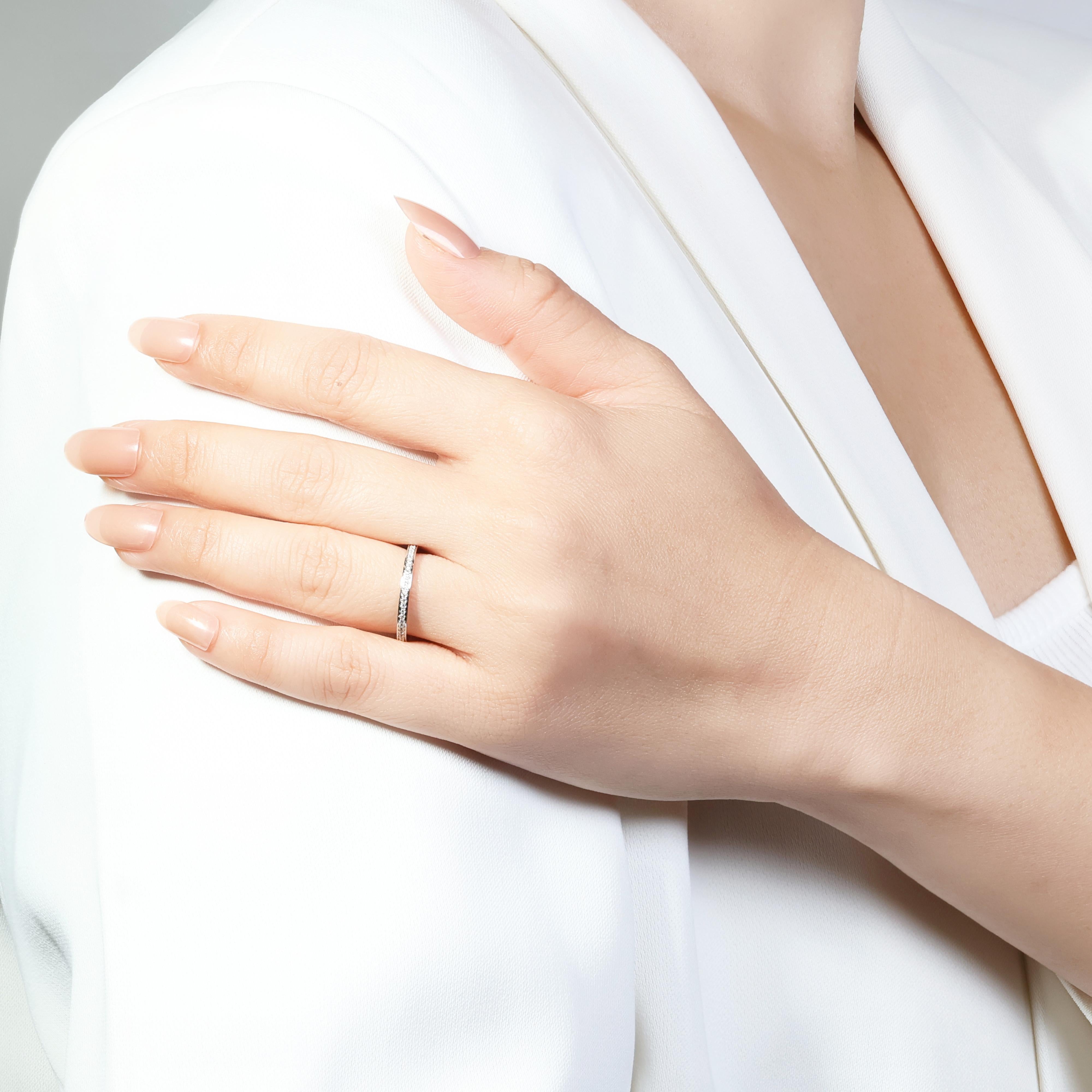 This elegant ring features a continuous row of sparkling diamonds, each graded G for color and VS for clarity. The total carat weight is 0.34ct, and the ring weighs 2.10g. Perfect for any occasion, this timeless piece is sure to impress with a 48/10