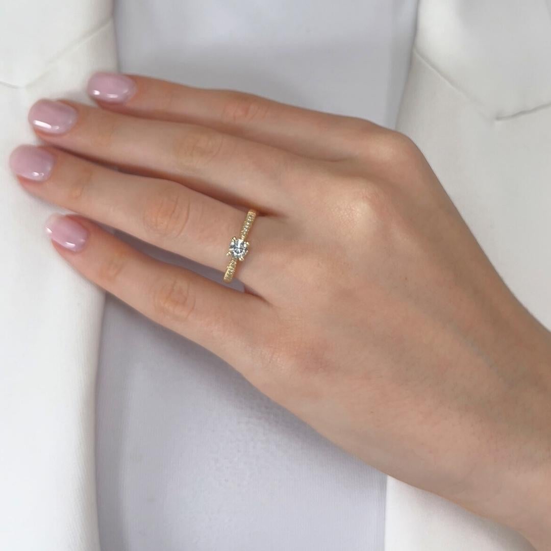 Classic 0.52ct Diamonds Pave Ring in 14k Yellow Gold - IGI Certified

Radiating warmth and brilliance, this 14K yellow gold pavé ring features a stunning 0.43ct round-cut diamond as its centerpiece, exuding exceptional brilliance and elegance.