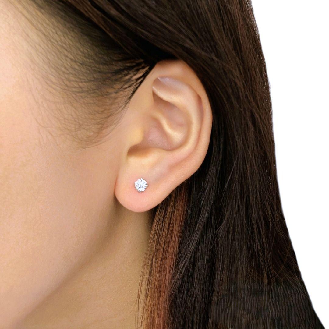 Timeless and effortlessly elegant, these new, unworn 18K white gold stud earrings showcase two exquisite round brilliant natural diamonds, totaling 0.54 carats. With their G-color and VVS1 clarity, each diamond radiates pure brilliance, catching the