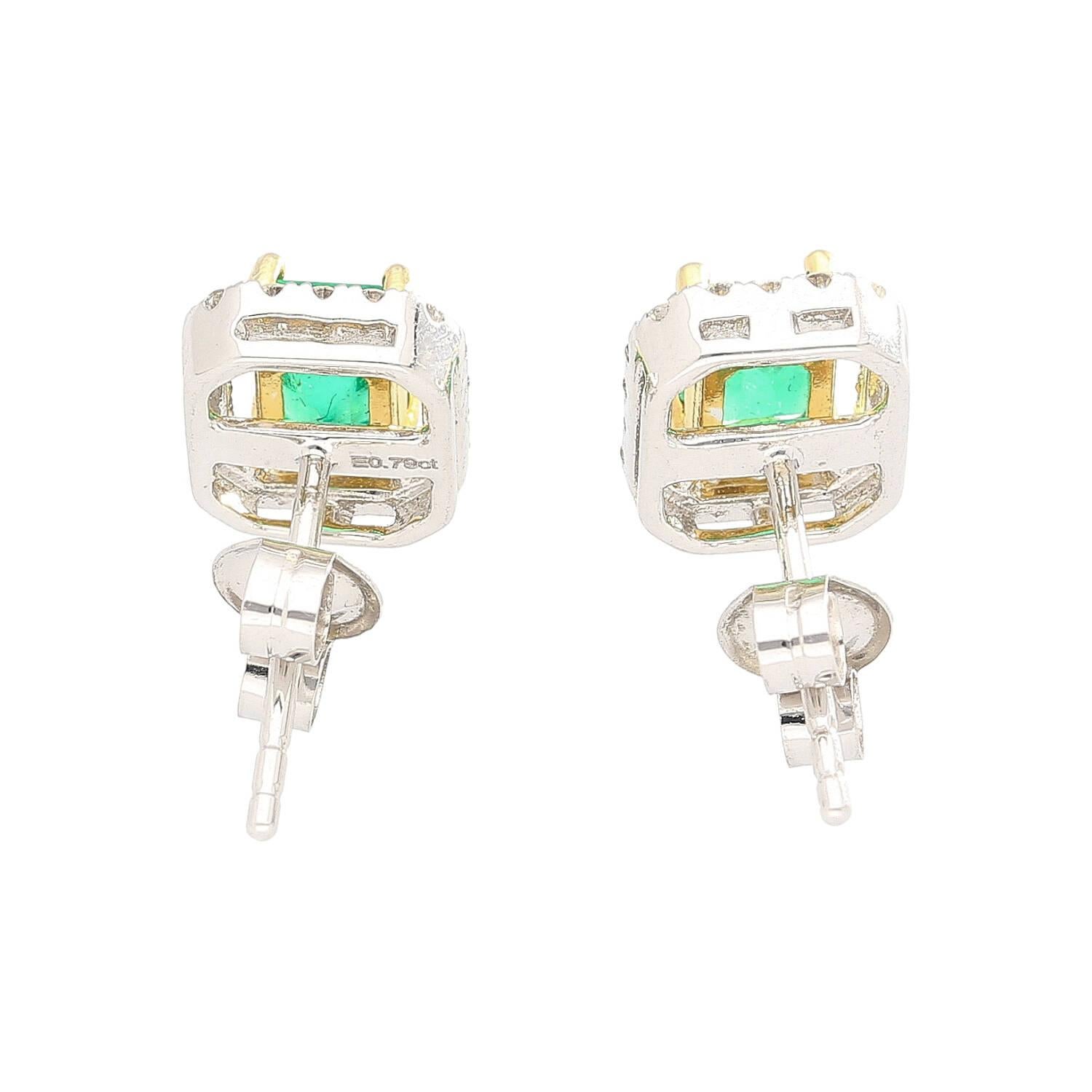 Shop these 0.79 carat emerald cut natural emerald and diamond halo stud earrings in 18k white gold. Mounted with a butterfly push-back closure. These studs feature a gap between the emerald and the diamonds, allowing for the yellow gold prong set
