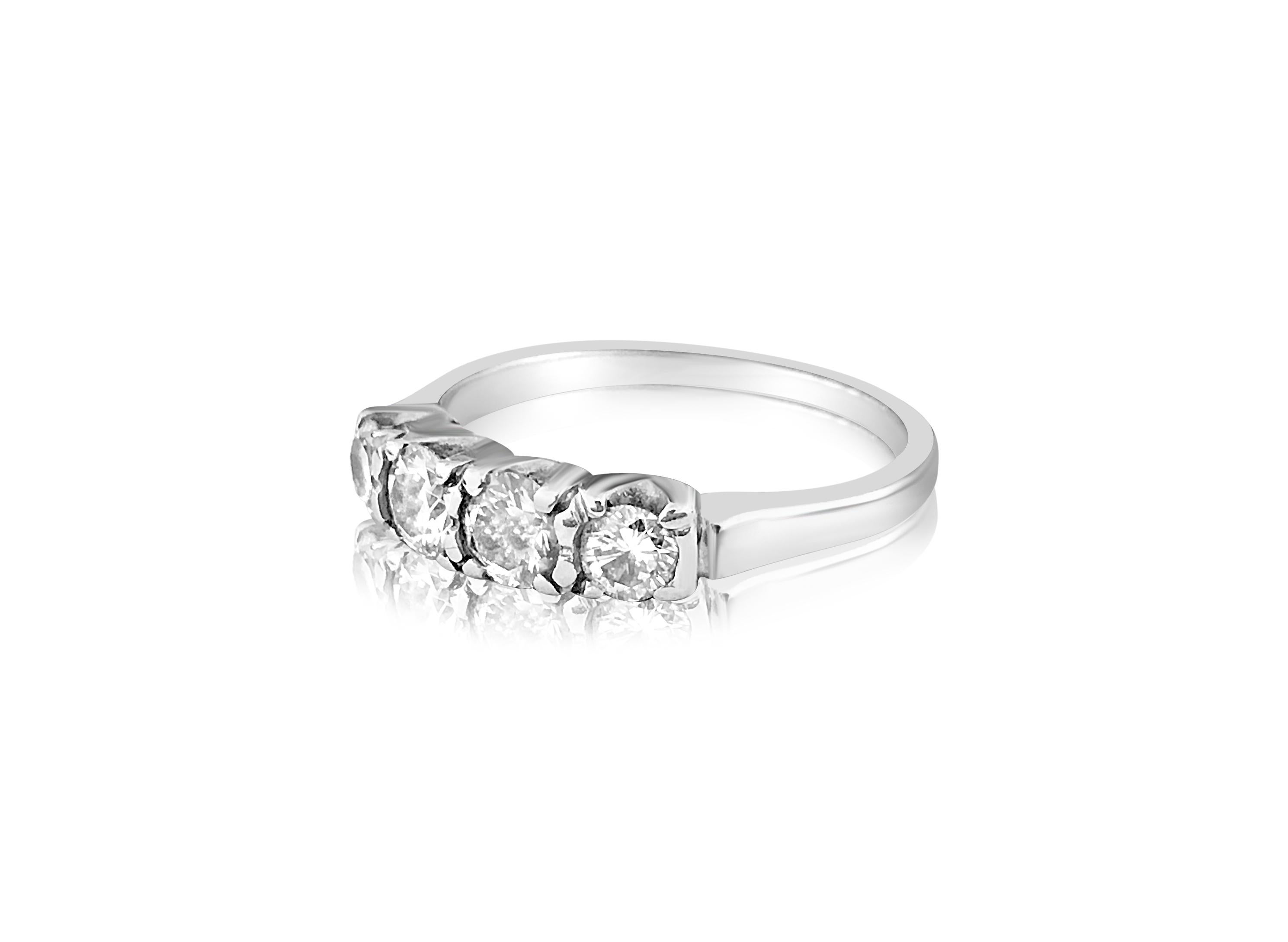 Metal: 14K white gold. 
Total carat weight of all diamonds: 1.00 carat. VS clarity and G color. Round brilliant cut diamonds in prongs. All diamonds are 100% natural earth mined. Four stone diamond wedding ring. Nice luster and shine. Womens