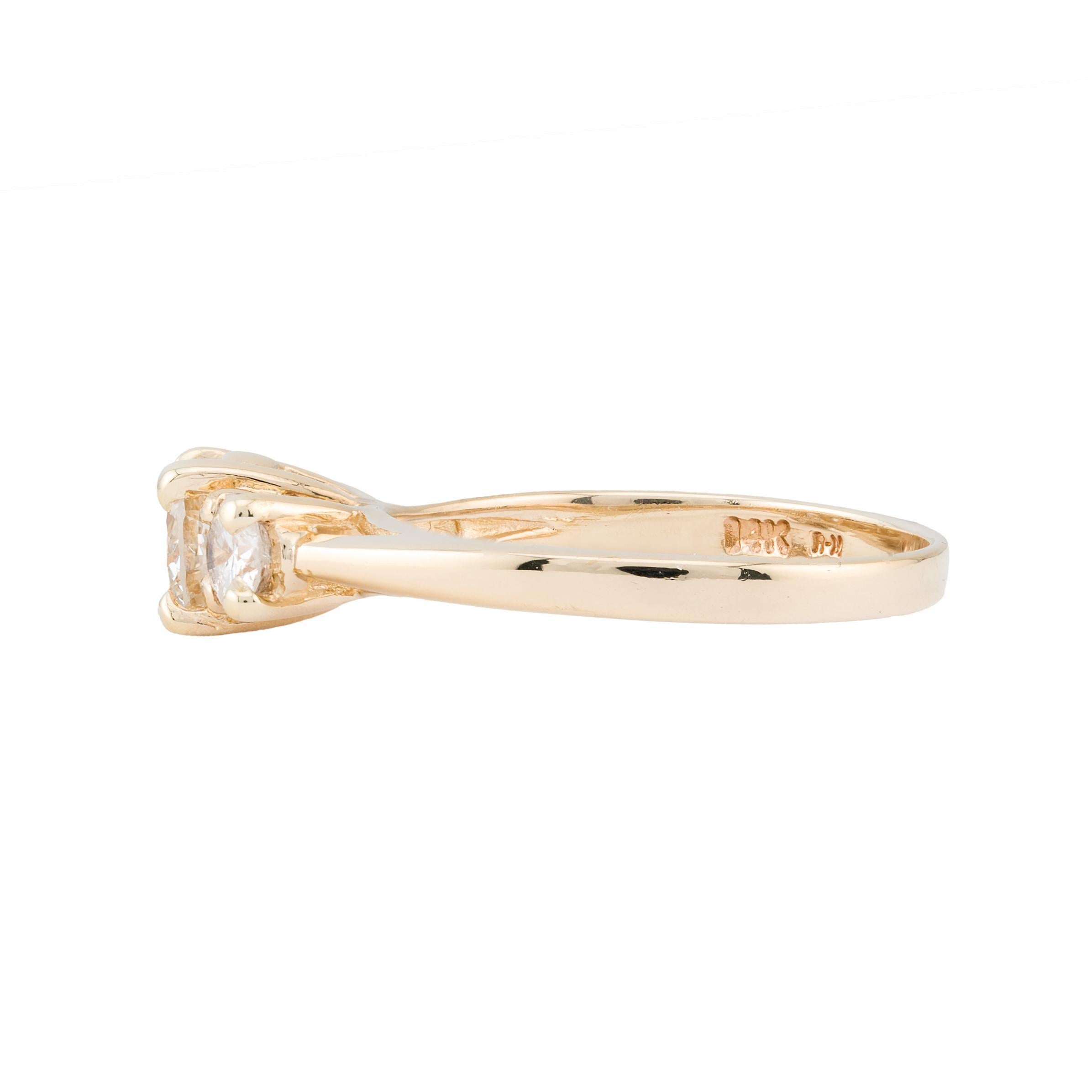 Aston Estate Jewelry Presents:

A stunning engagement ring featuring a central brilliant-cut diamond of 0.60 carats, H color, SI1 clarity. Flanked by two brilliant-cut diamonds totaling 0.40 carats, also of H color, SI1 clarity.

This elegant piece