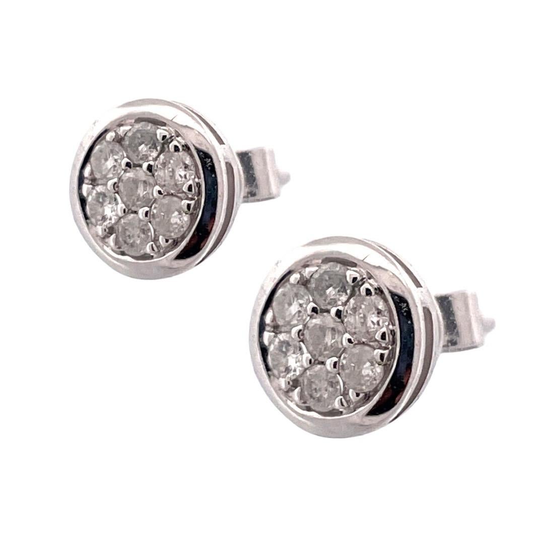 Classic 10k White Gold Round Diamond Stud Earrings

Elevate your elegance with our Classic Round Diamond Stud Earrings crafted in 10k white gold. The earrings feature a stunning arrangement of seven brilliant diamonds, totaling 0.31 carats.With a