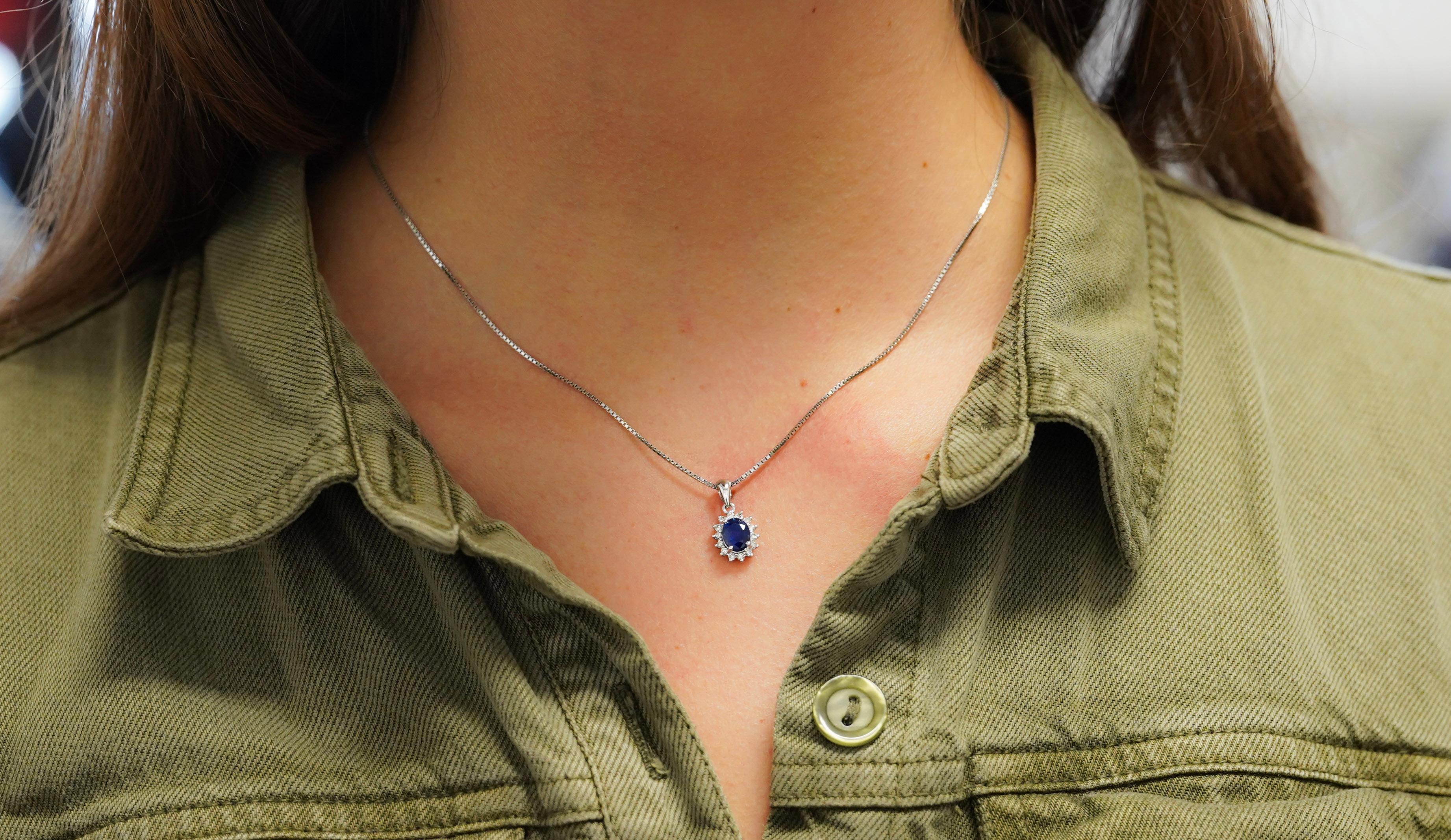 Item Details:
- Type: Drop Pendant Necklace
- Metal: 18K White Gold
- Weight: 1.05 Grams (pendant only)
- Setting: Prong, Halo
______________________________

Center Stone Details:
- Type: Natural Sapphire
- Carat: 1.20
- Cut: Oval
- Color: Blue
-