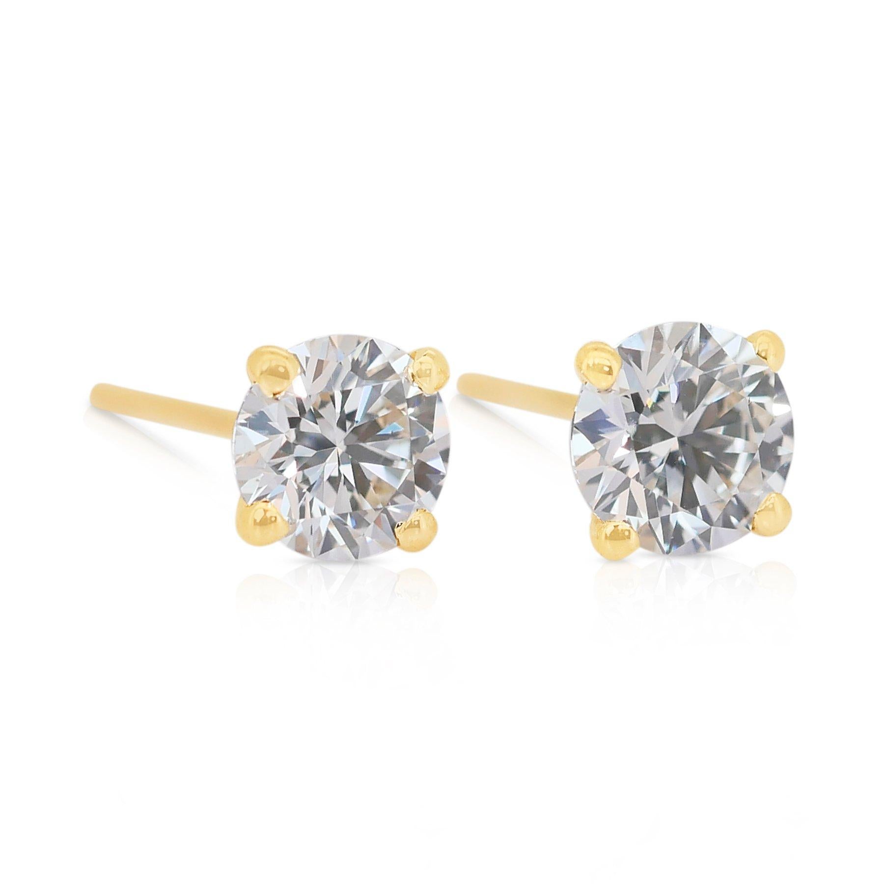 Classic 1.43ct Triple Excellent Ideal Cut Diamonds Stud Earrings in 18k Yellow Gold - GIA Certified

Discover timeless luxury with these exceptional diamond earrings, expertly crafted in 18K yellow gold. Showcasing two perfectly matched round