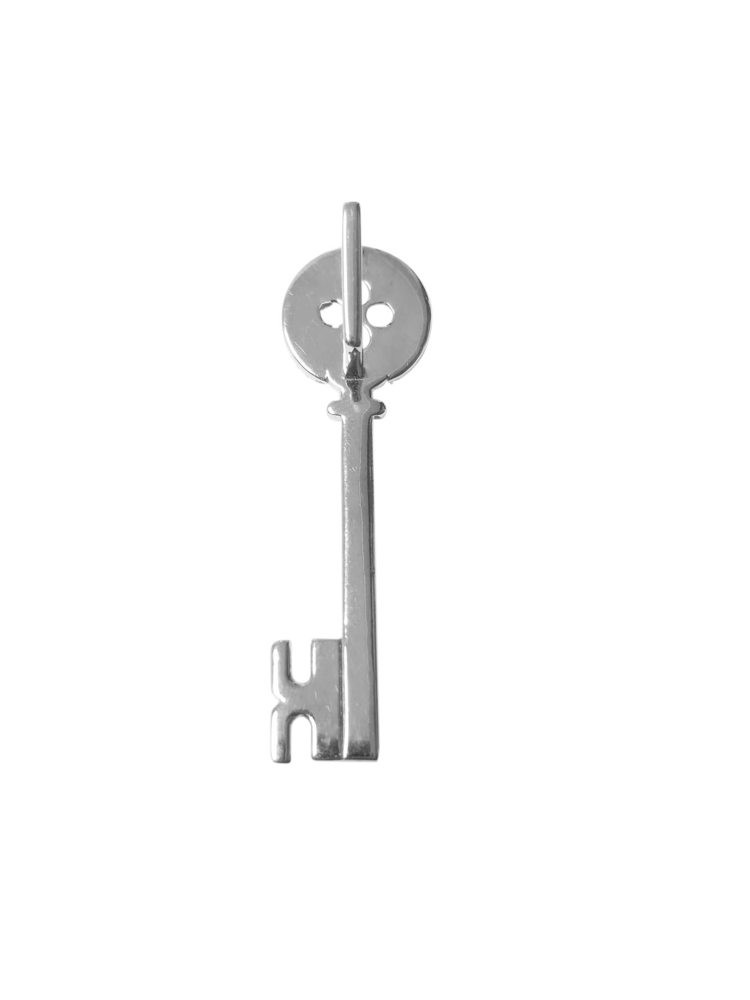 Crafted from 14k gold, this key pendant weighs 6.9 grams and measures 2 x 0.60 inches, featuring 2 carats total weight of diamonds with SI1 clarity and G color. The pendant is a stylish and substantial piece of jewelry, perfect for adding elegance