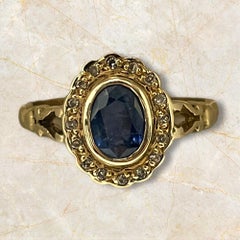 Bague classique en or 14K avec halo de saphir et accents de diamant