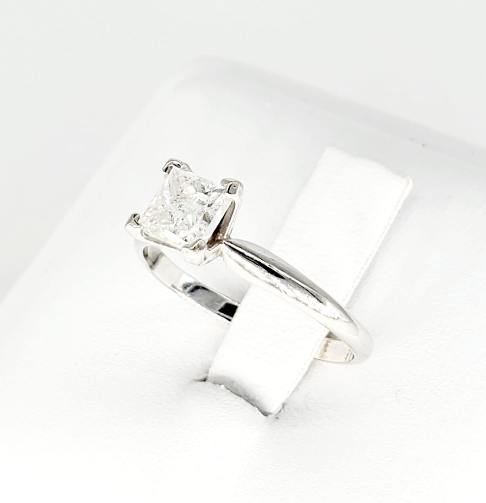 14k White Gold 0.75 Carat Princess Cut Diamond Solitaire Ring. The Diamonds clarity clarity I/H and is a size 6.5