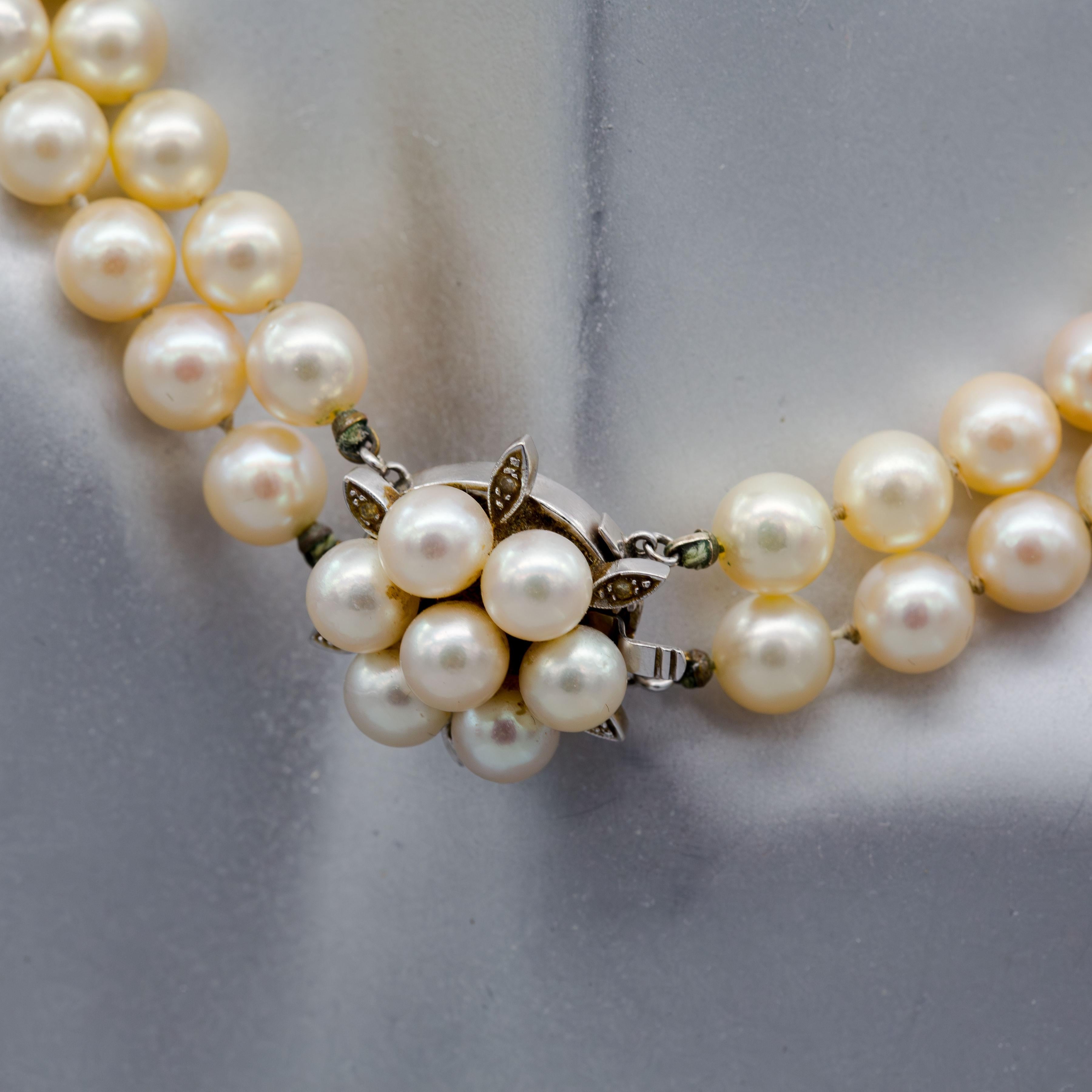 Material: 14k White Gold
Weight: 66.1 grams
Gemstone: Diamond 0.06 cttw
Pearl 8.2mm
Length: 14.75 inches

Classic double strand pearl necklace dating back to 1950's! Decorated with 14k white gold clasp that features diamond chips. This classic