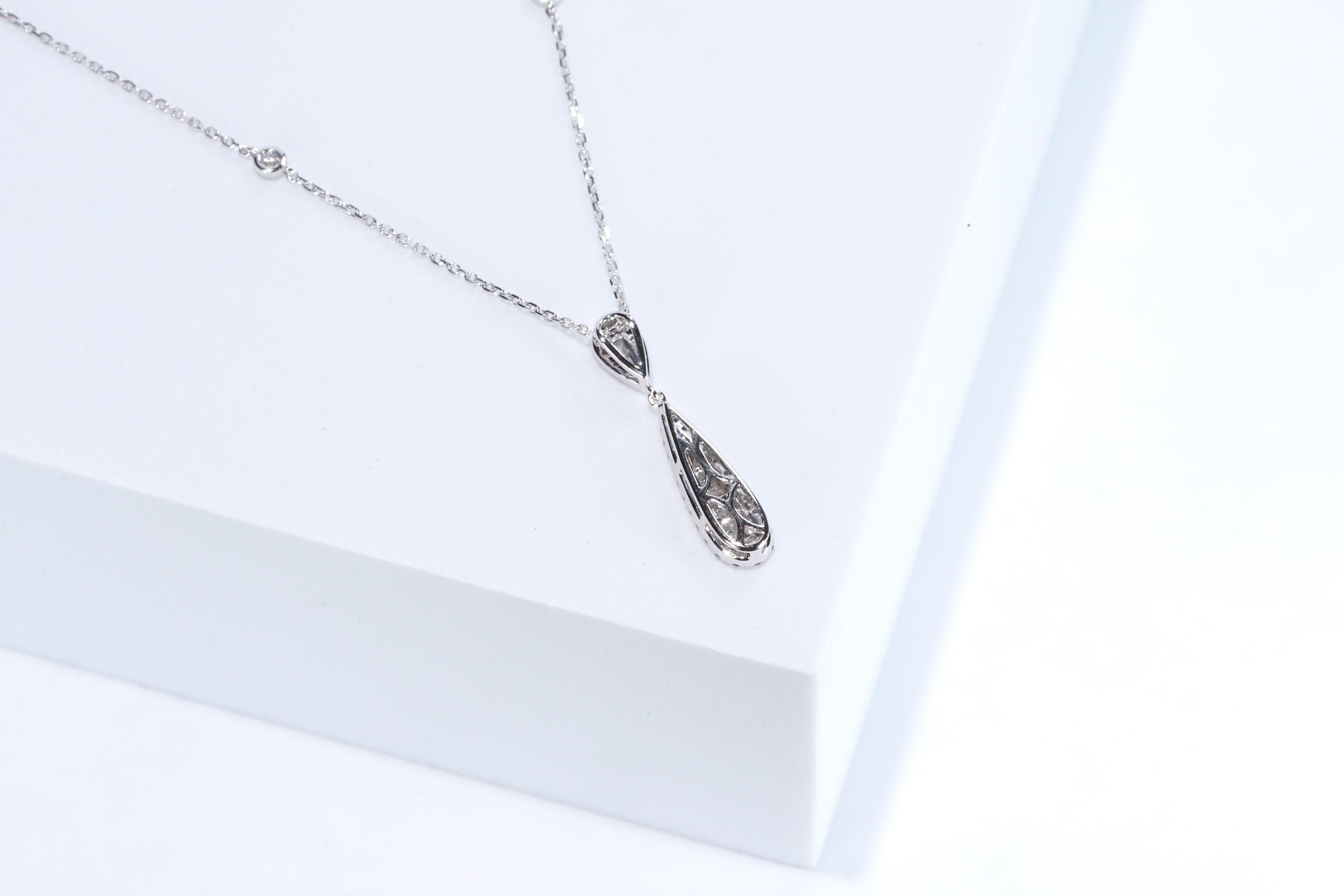 Decorate yourself in elegance with this Pendant is crafted from 14-karat White Gold by Gin & Grace. This Pendant is made up of Round-cut White Diamond (36 Pcs) 0.32 Carat, Baguette-cut White Diamond (10 pcs) 0.19 carat. This Pendant is weight 2.93