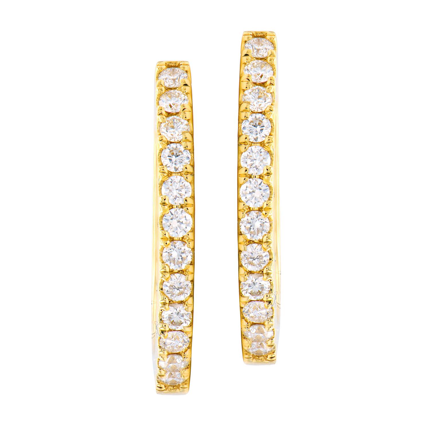 These hoops are classic and timeless. They are made from 2.4 grams of 14 karat yellow gold with a row of diamonds on the front side. The 24 round diamonds are SI, H color and total 0.26 carats. They are secured through the ear with a post that snaps