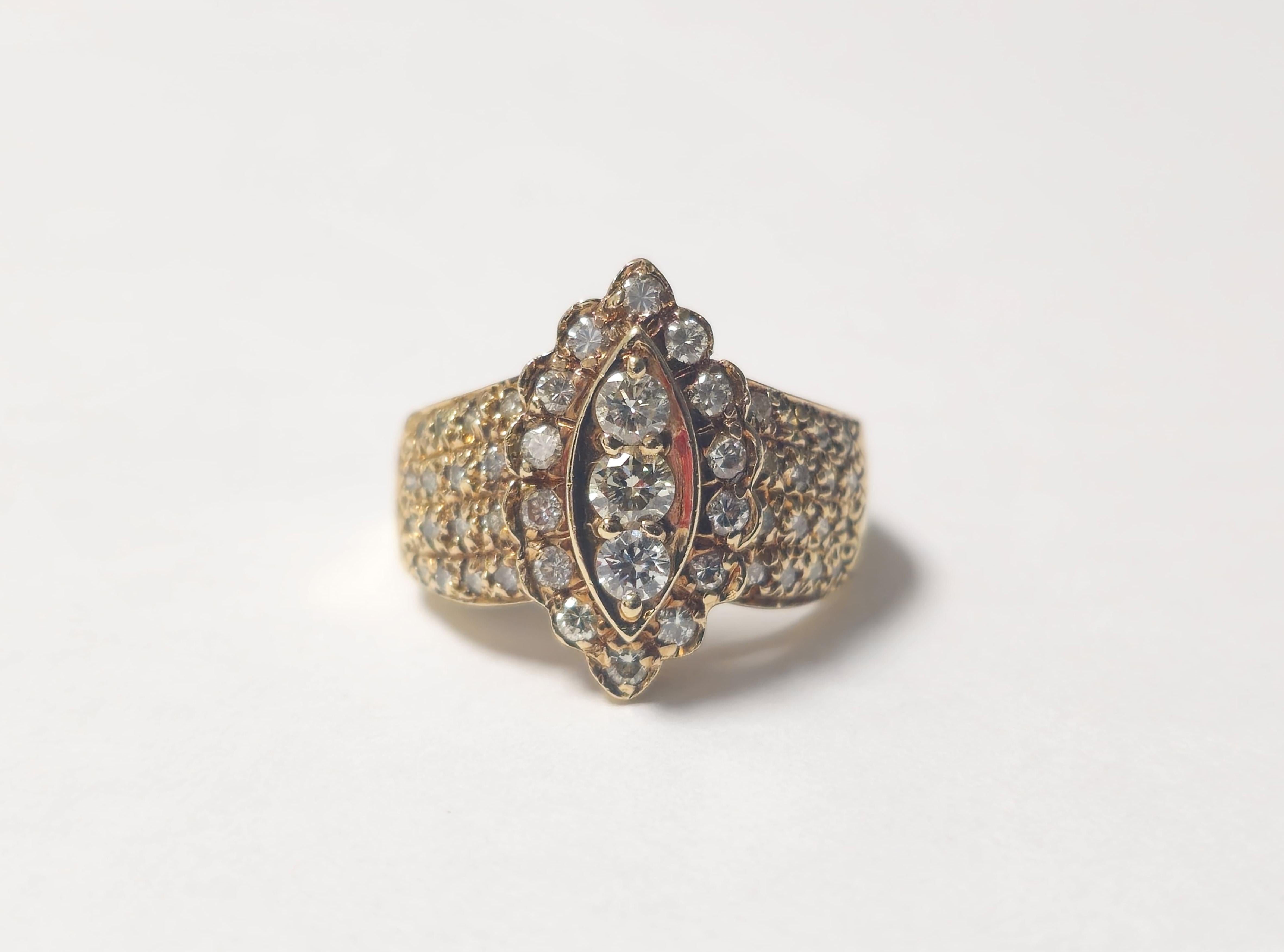 Crafted from 14k gold, this ring weighs 6 grams and is sized at US 6.75, showcasing a total of 2.3 carats of diamonds with SI1-SI2 clarity and G-H color. The design highlights a captivating arrangement of diamonds, offering sparkle and brilliance.